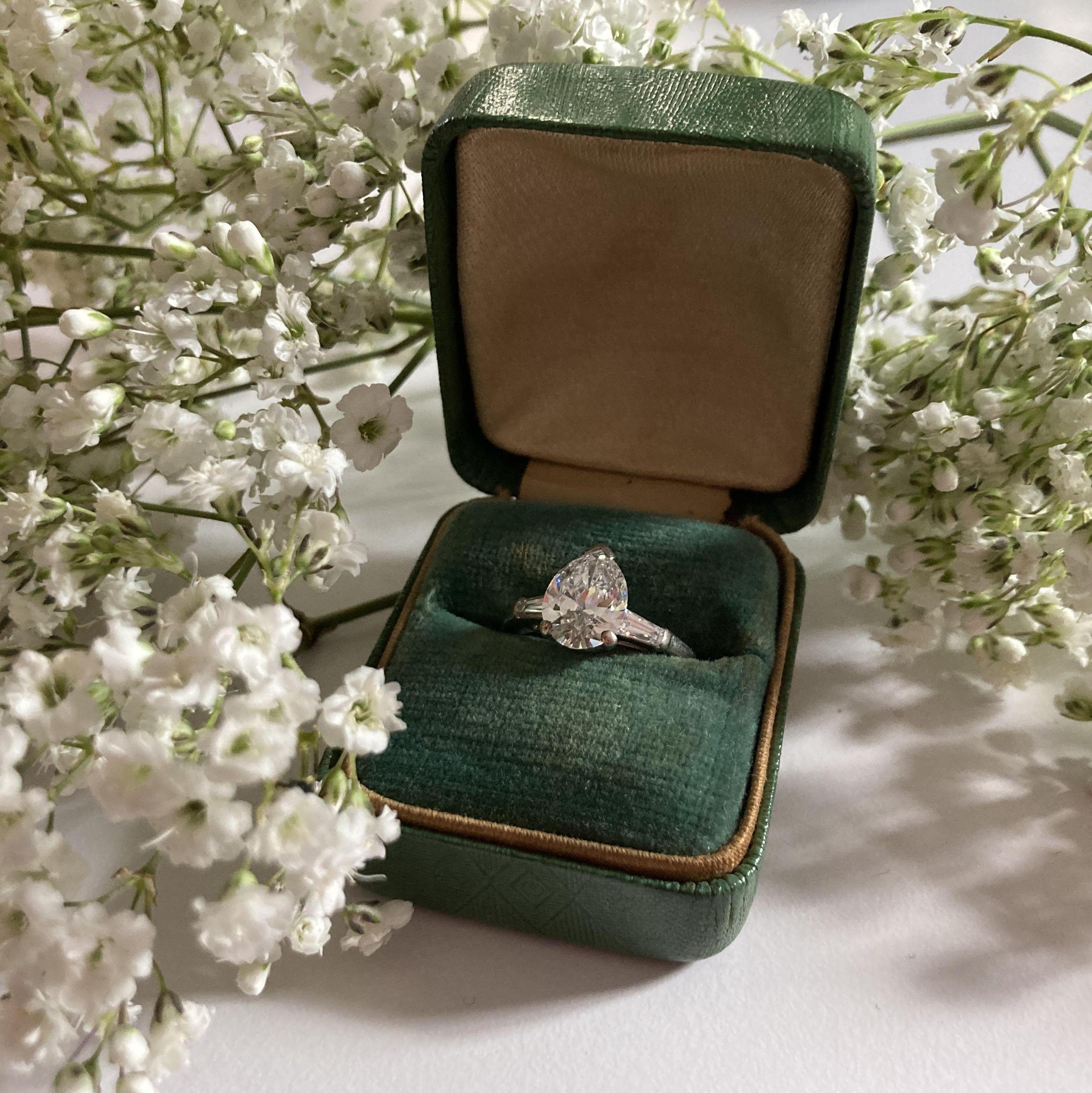 Kevin proposed with the ring that originally belonged to his grandmother, Claire. Later it was sized and customized to fit Leah.