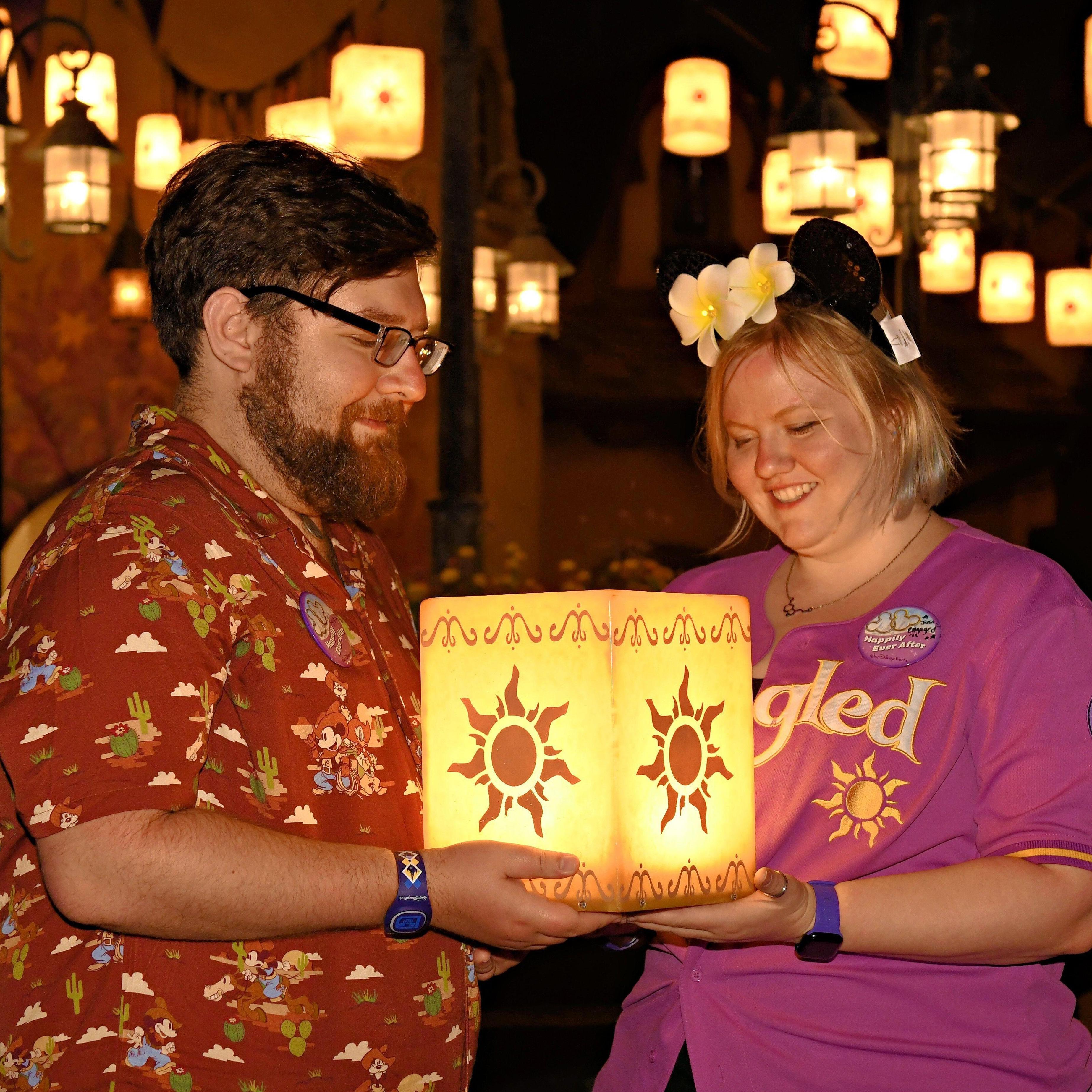 Holding a lantern from Tangled in Magic Kingdom!