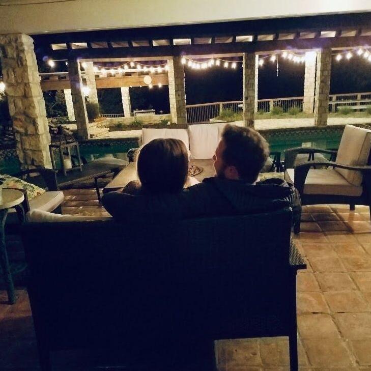 David's mom snuck a picture of us laughing on the patio together
