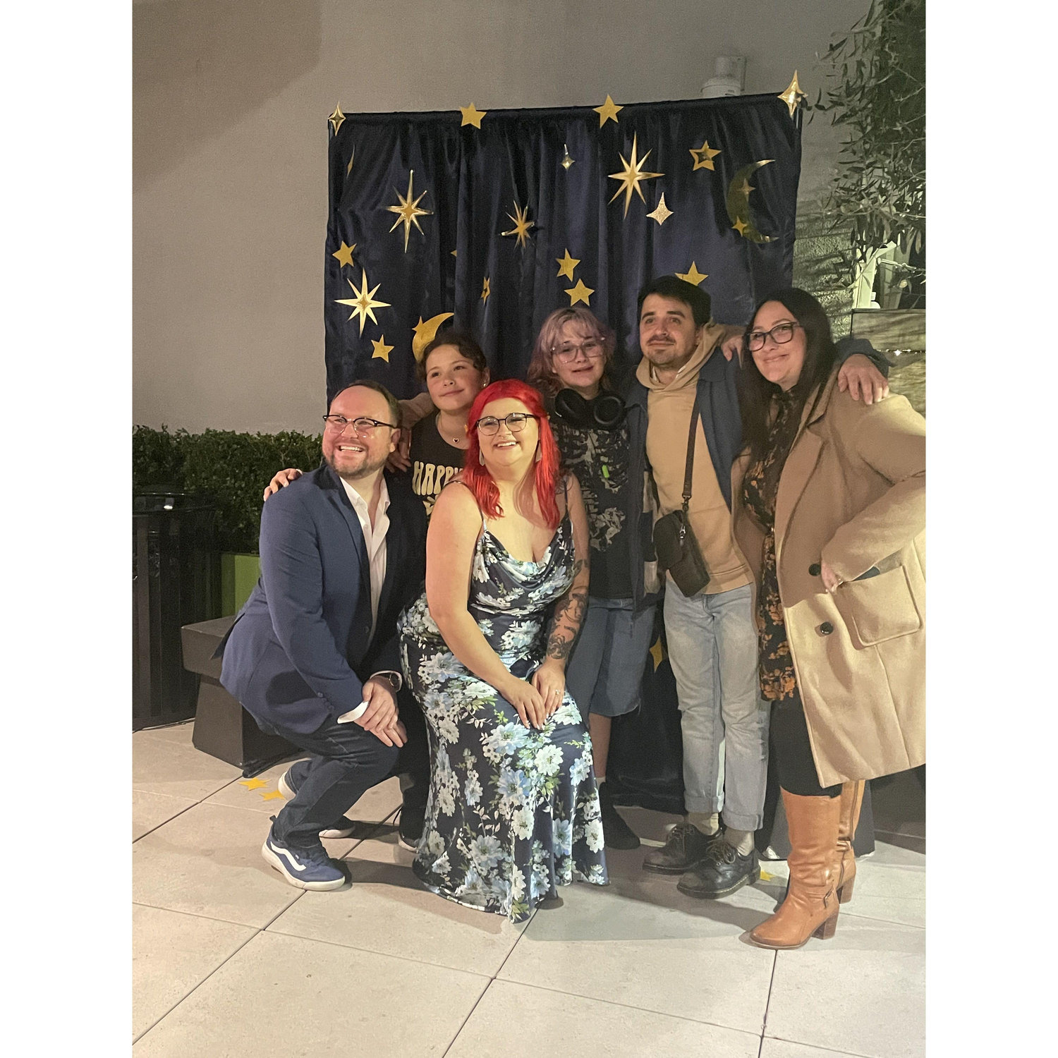 Nina was surprised by friends and family waiting on their rooftop after John proposed!