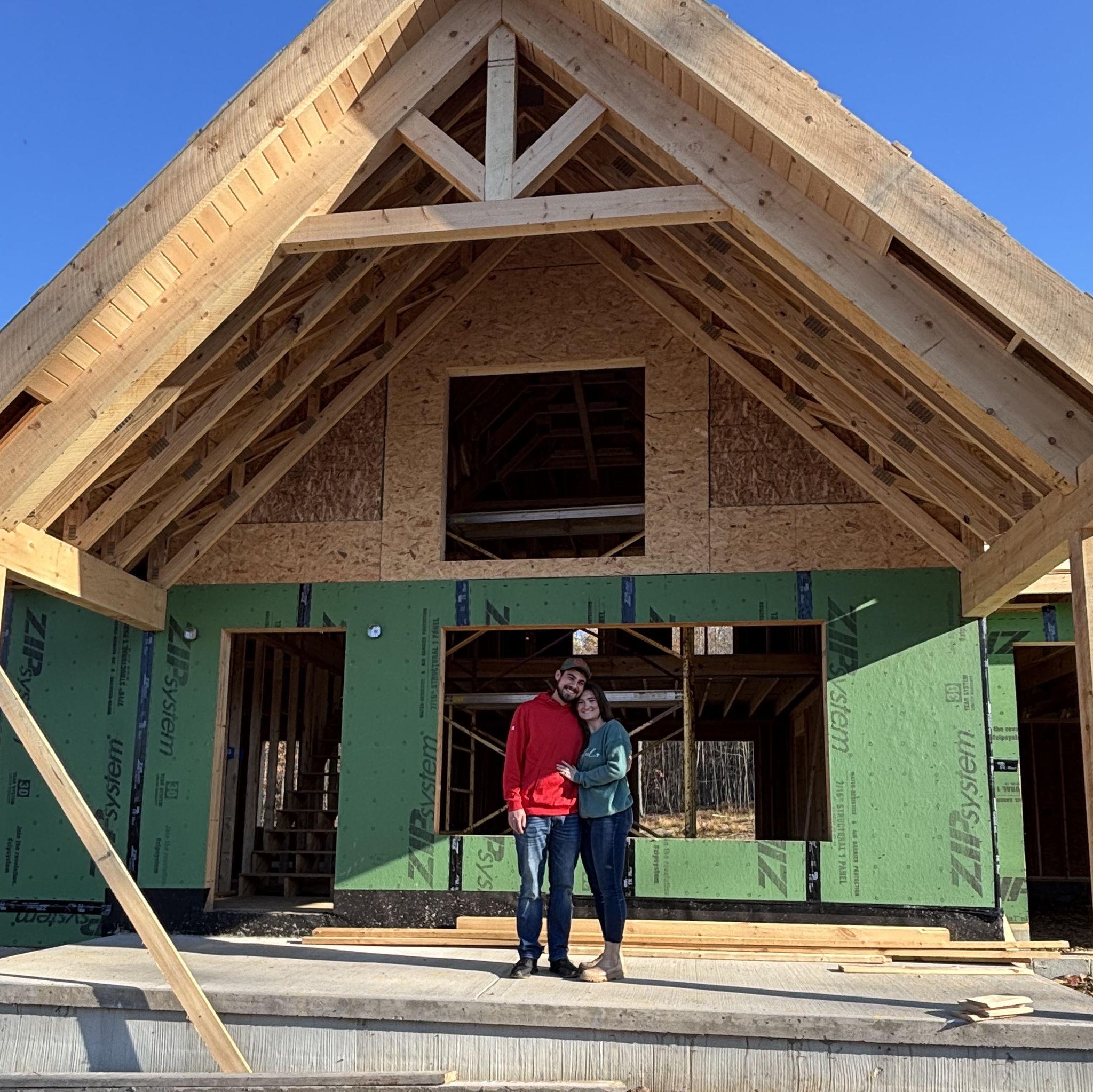 Us standing in front of our future home