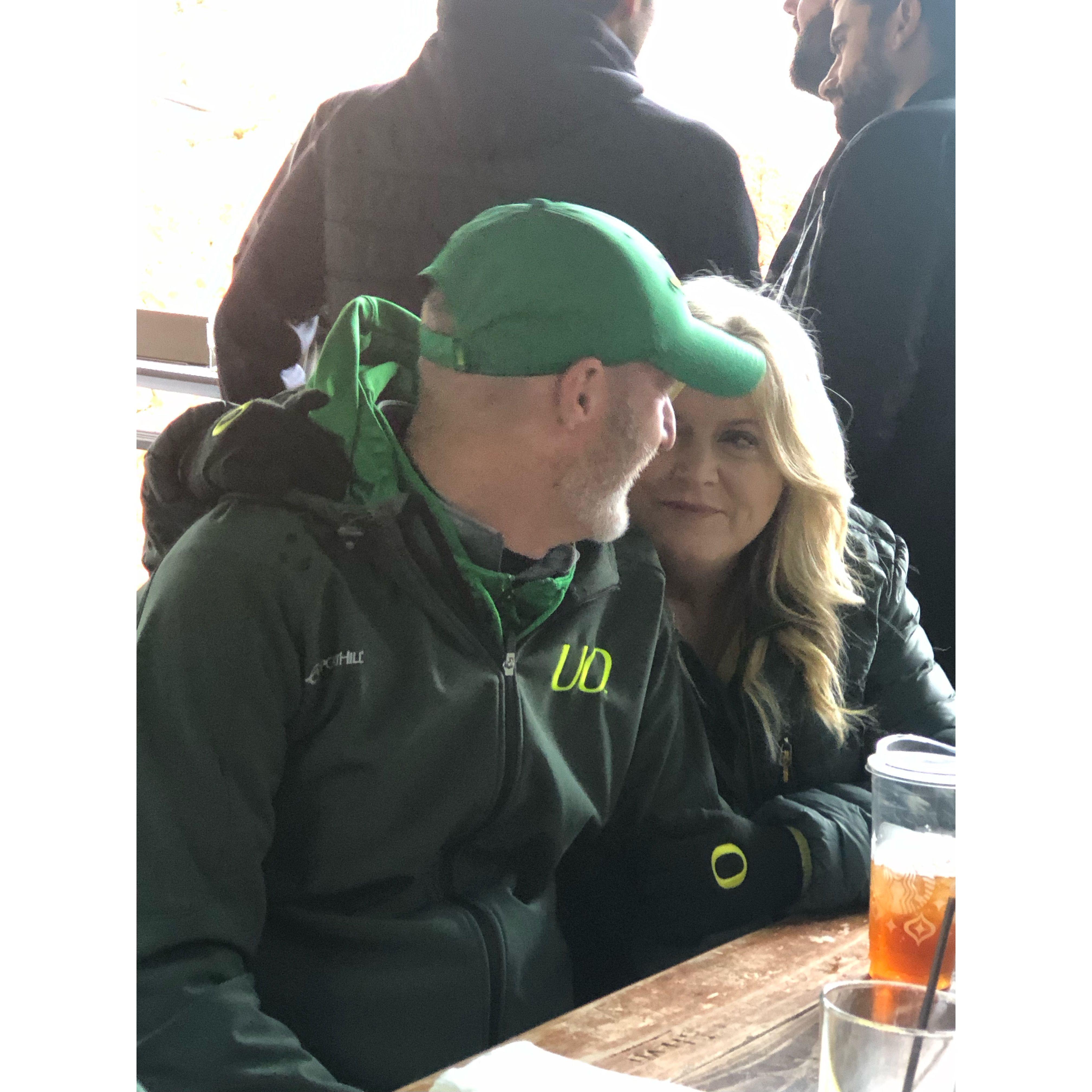 Private moment at a Duck football game
