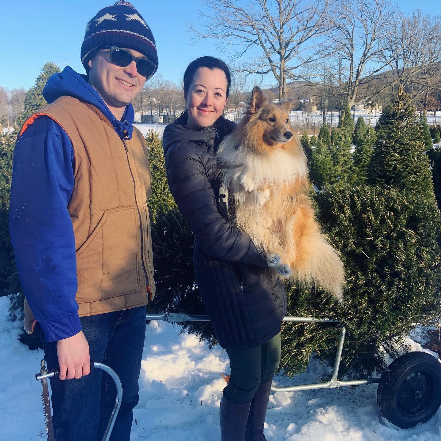 Cutting down our first Christmas tree together, of course our buddy Jameson was there!