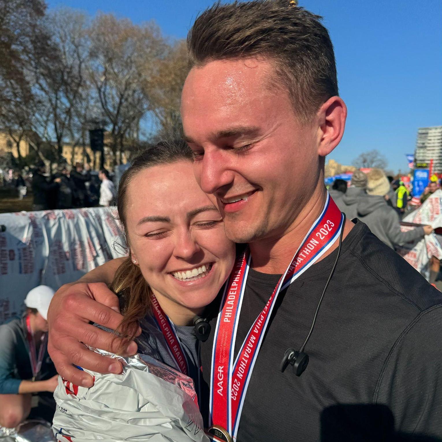 Taken at the finish line of the Philadelphia marathon. We trained together just a few months into dating.