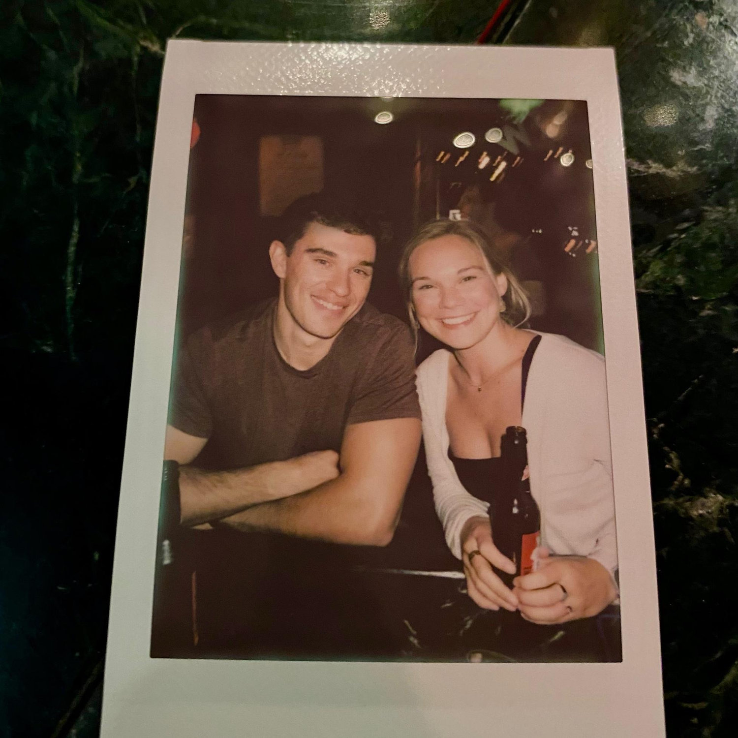 One of our first dates. We went to a bar where you could take a polaroid and put it in the wall!