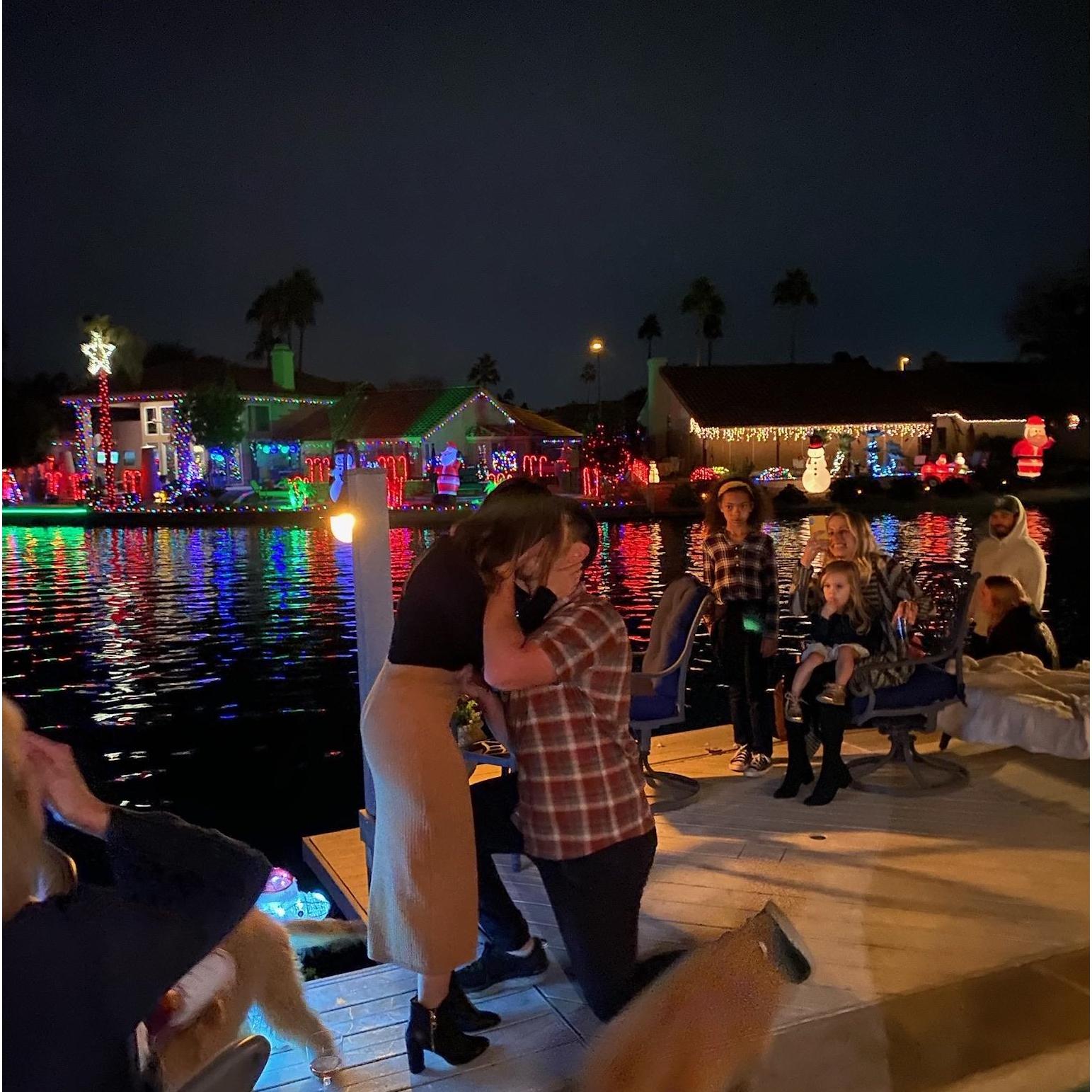 Matt's proposal at the annual Schultz boat Parade! Ignore the blurry dog at our feet.