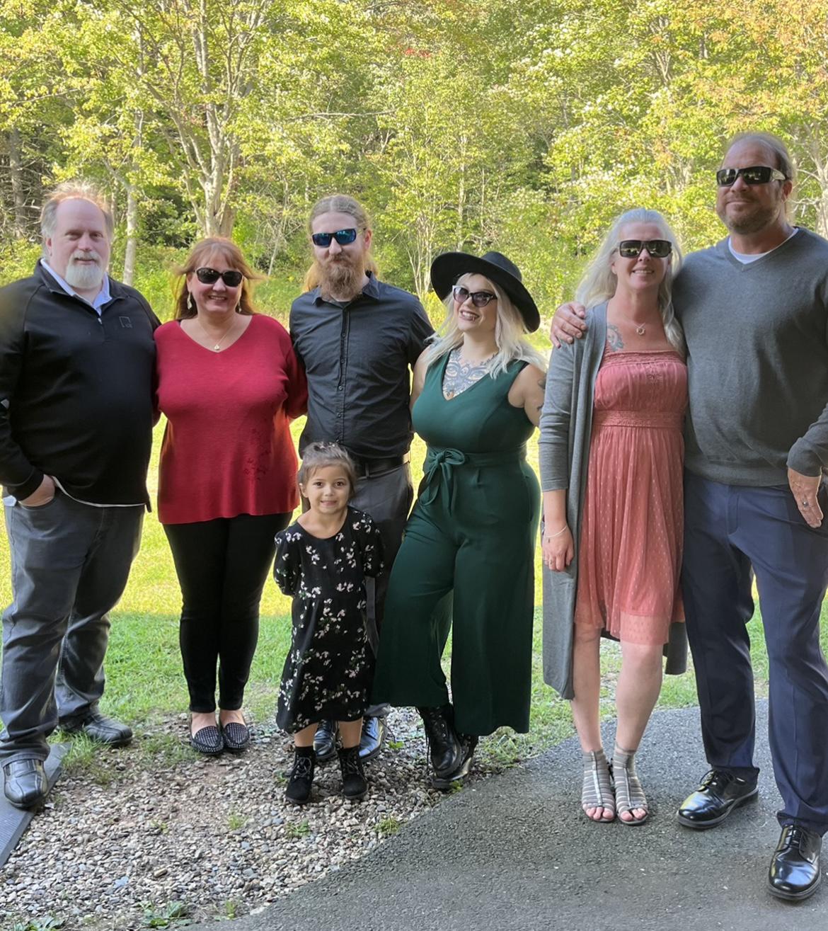 Left to right
Father of the groom - Shawn, mother of the groom - Rachel, Groom, daughter & flower girl- Willow , Bride , mother of the bride - Kristin Father of the bride- Bill