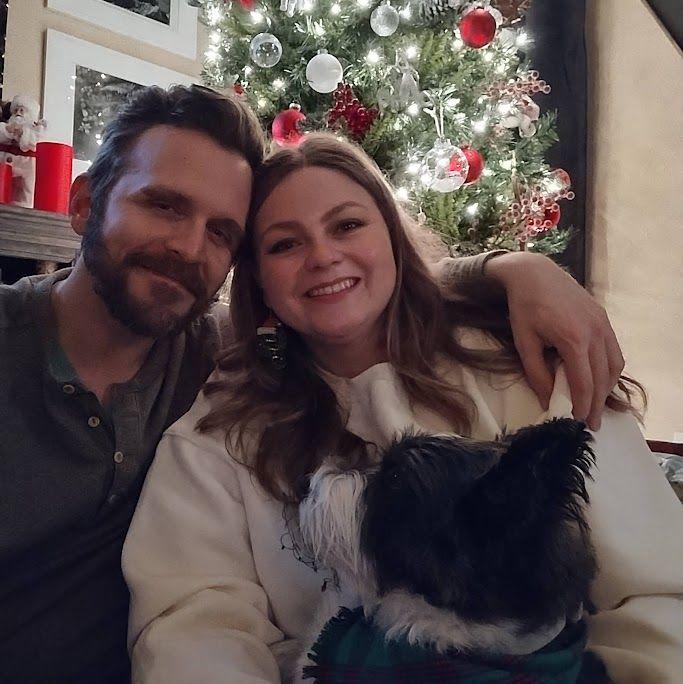 Family photo in front of the Christmas Tree.