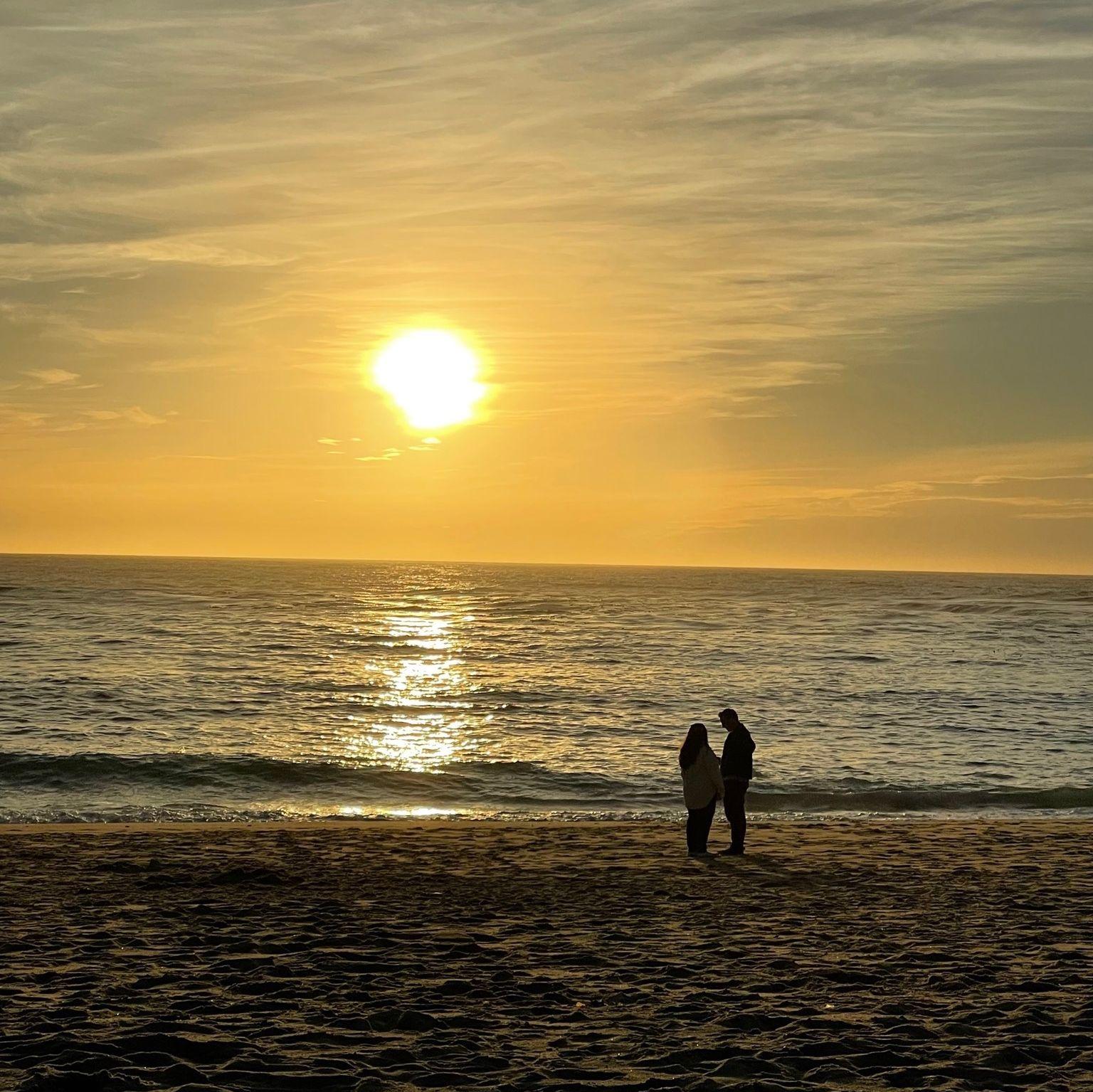 A photo strangers took of us at sunset in Carmel.