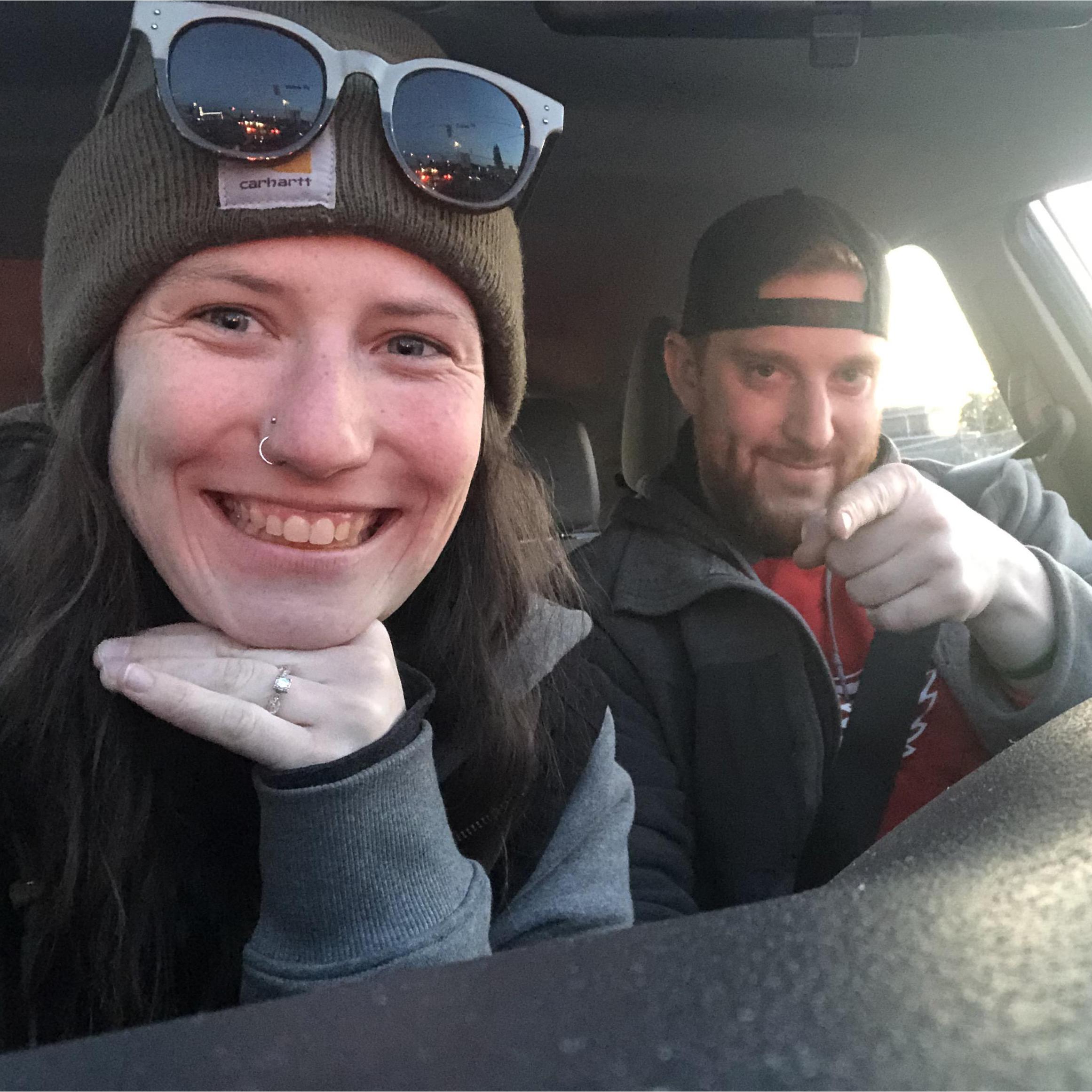 Our favorite thing to do together is travel. Here's us driving from Seattle, WA to Vancouver, BC, right after we got engaged.