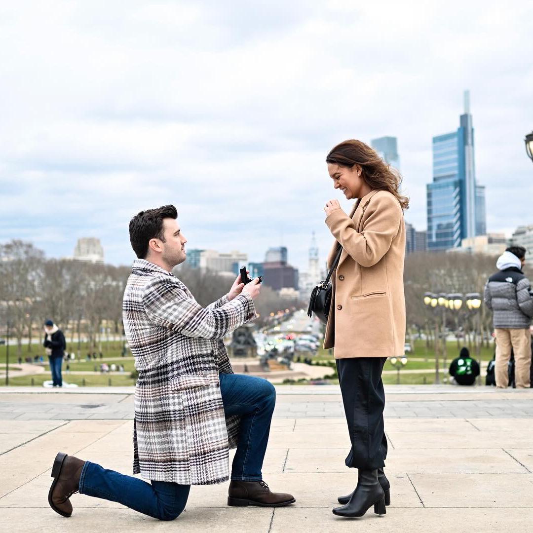 The couple’s best day. Mike surprised Jordan at the top of the art museum’ stairs overlooking the place they made their first home together, with a promise of forever.