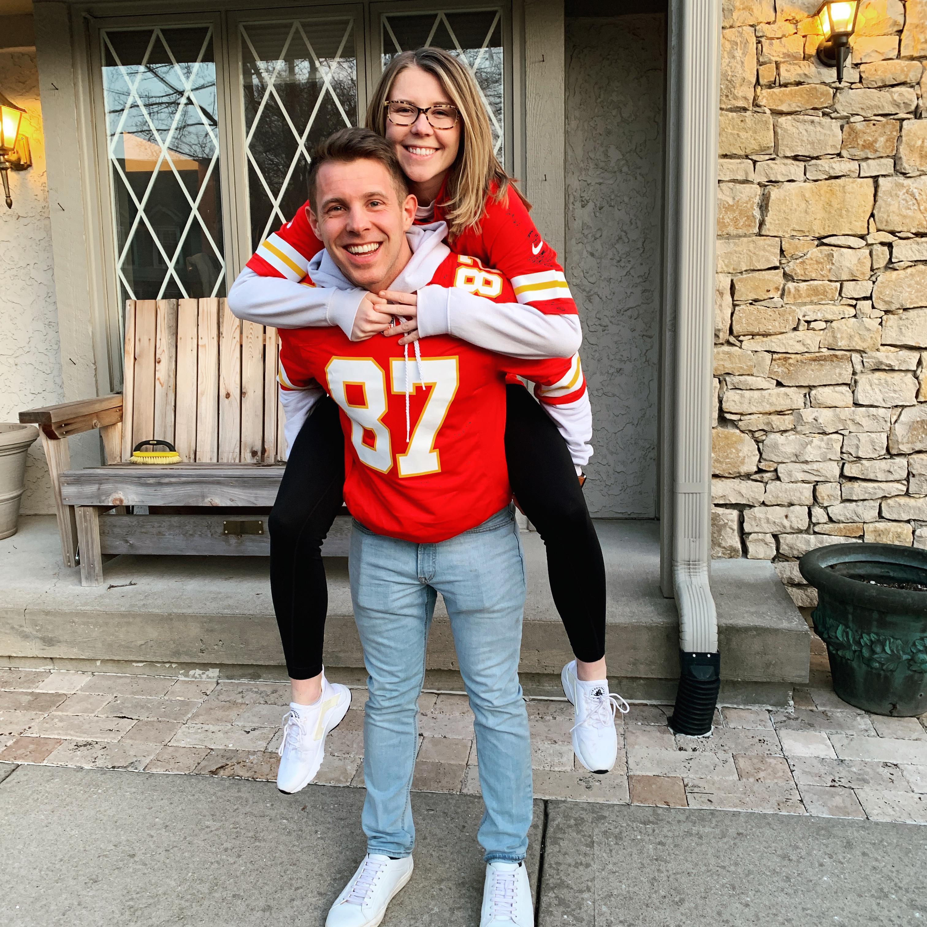 This is a photo of a lifelong Chiefs fan introducing a football lover to the best fan base in the country. KC has now become of their favorite team.