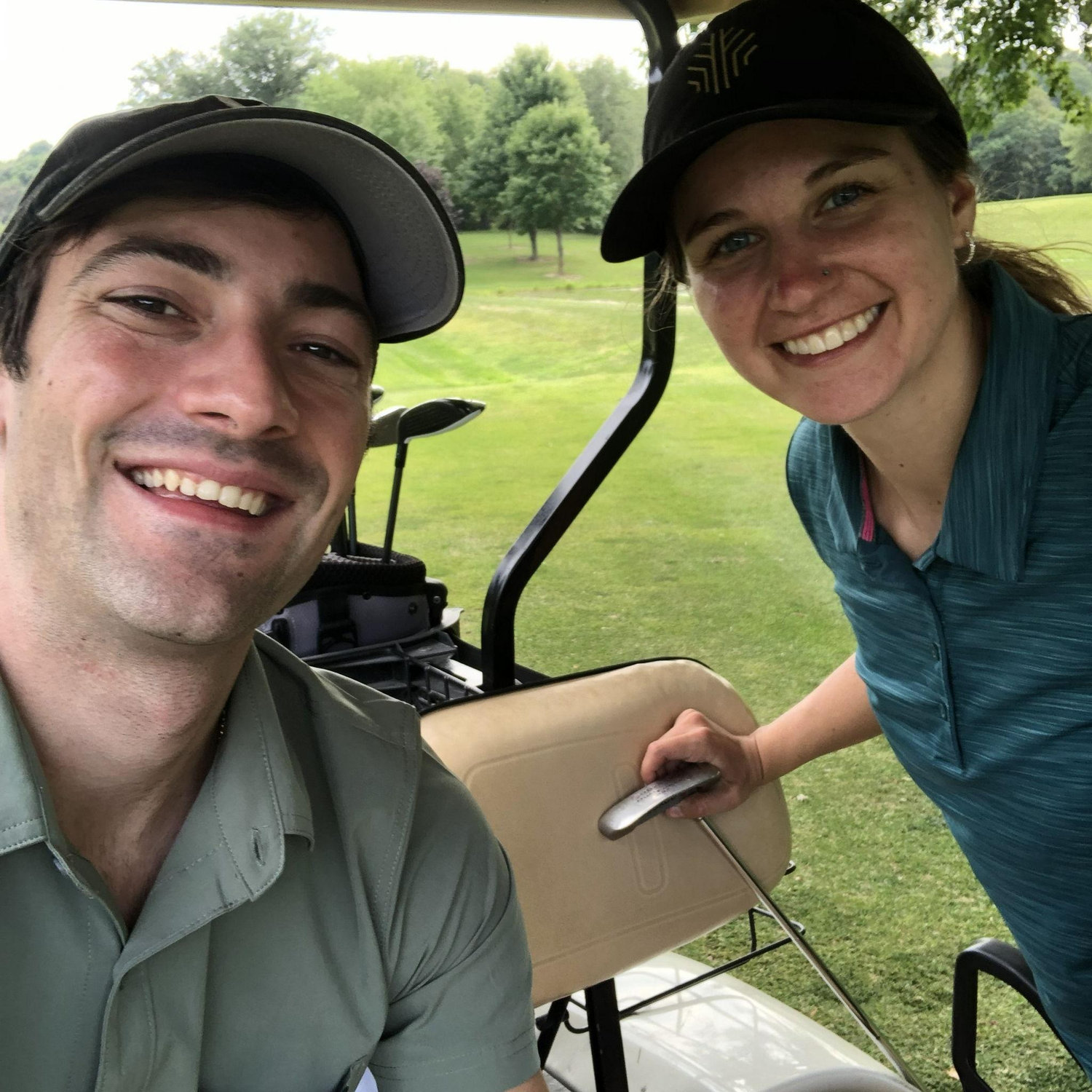Amanda teaching Jordan how to golf.