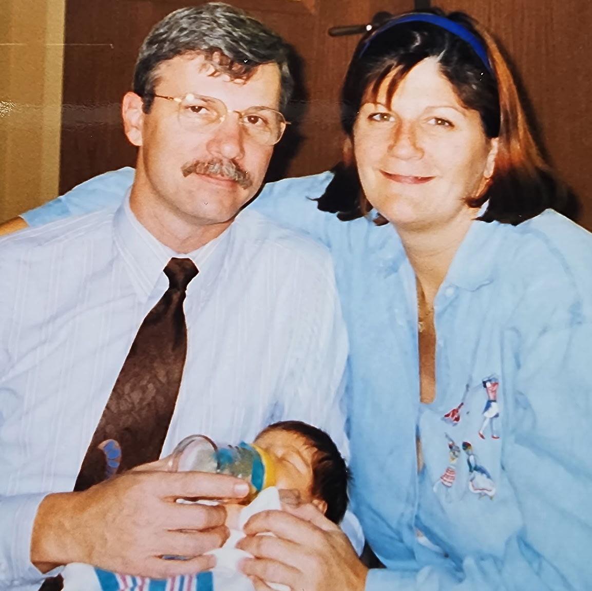 Newborn Justin with his parents, Tom and Cathy, November 1997