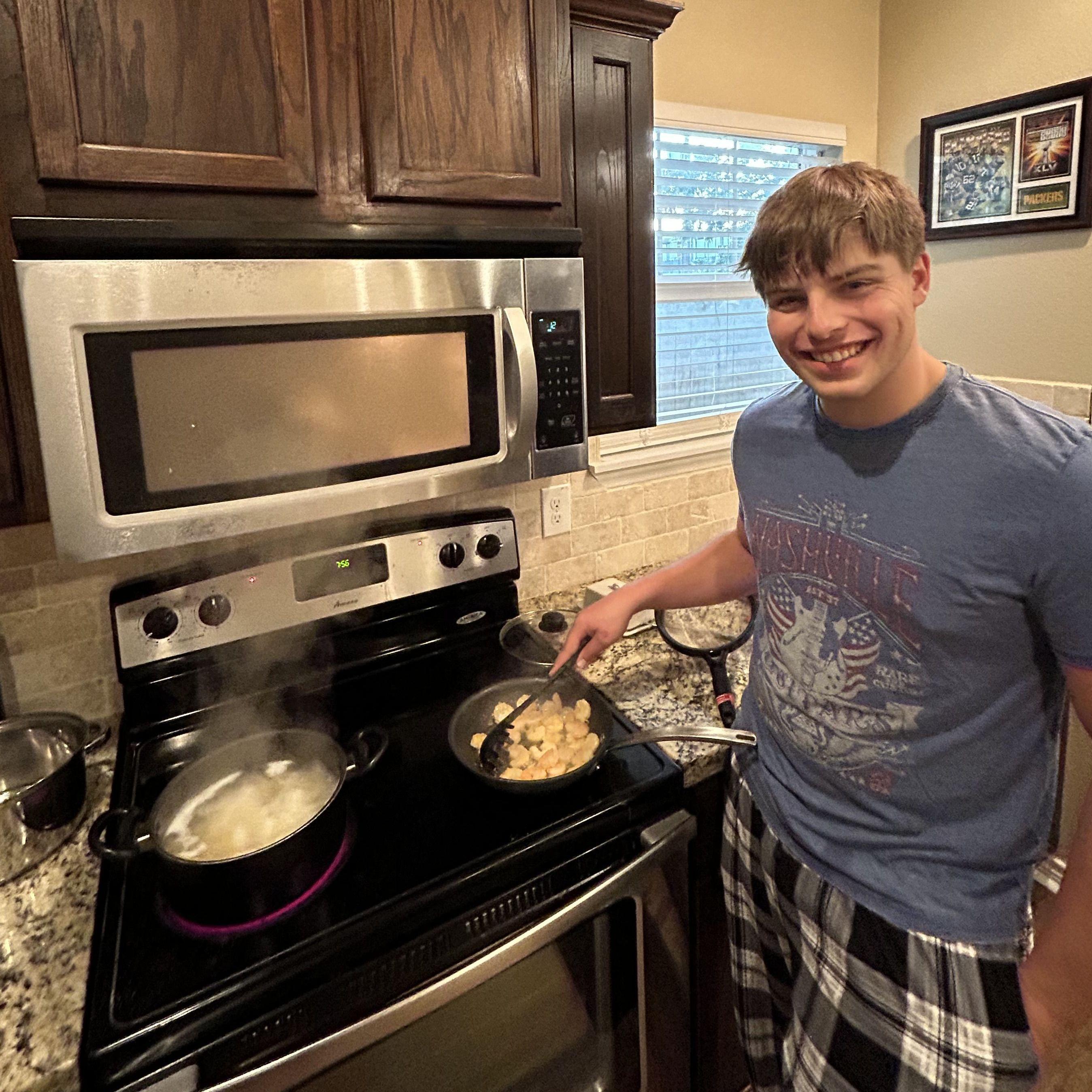 Ben making his famous shrimp alfredo, treating Kylee to a night of cooking.