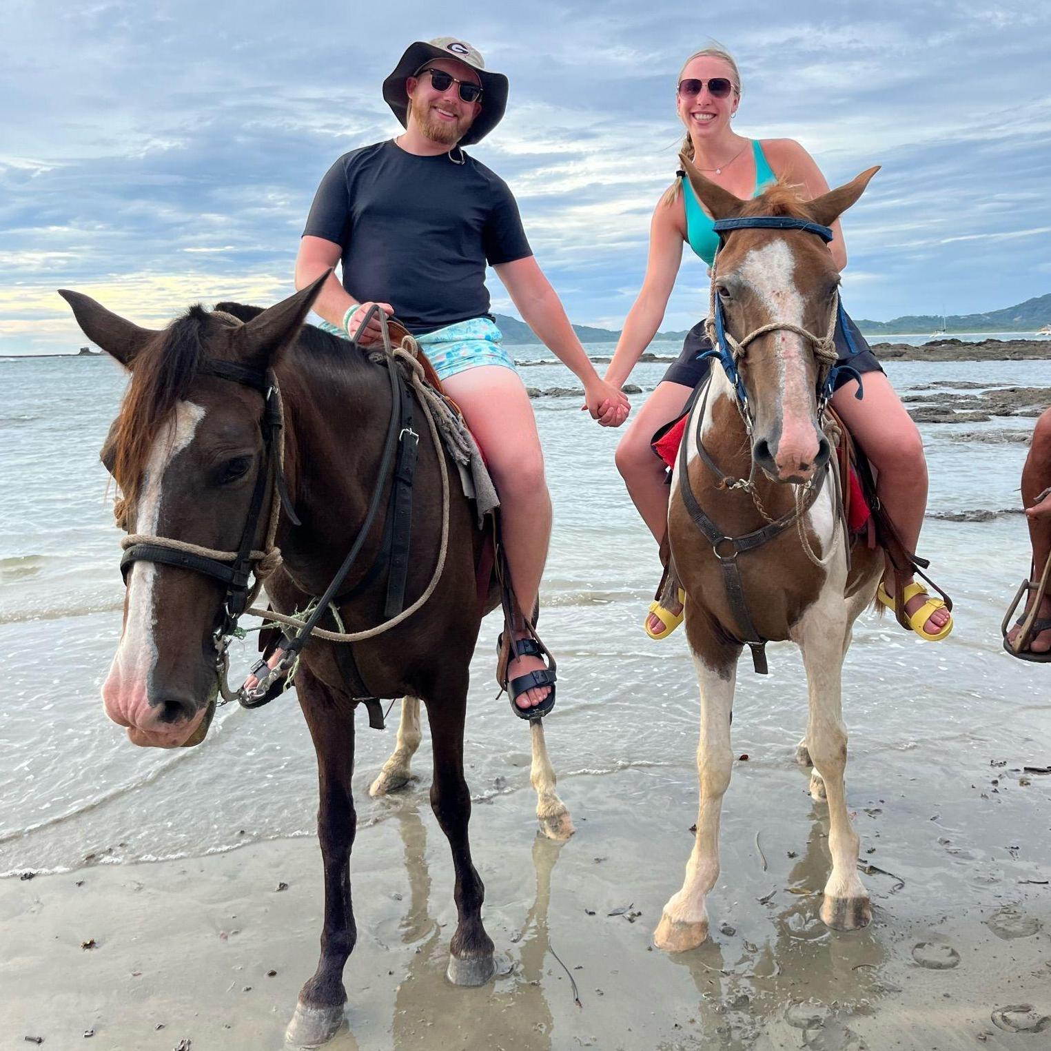 Riding horses on the beach