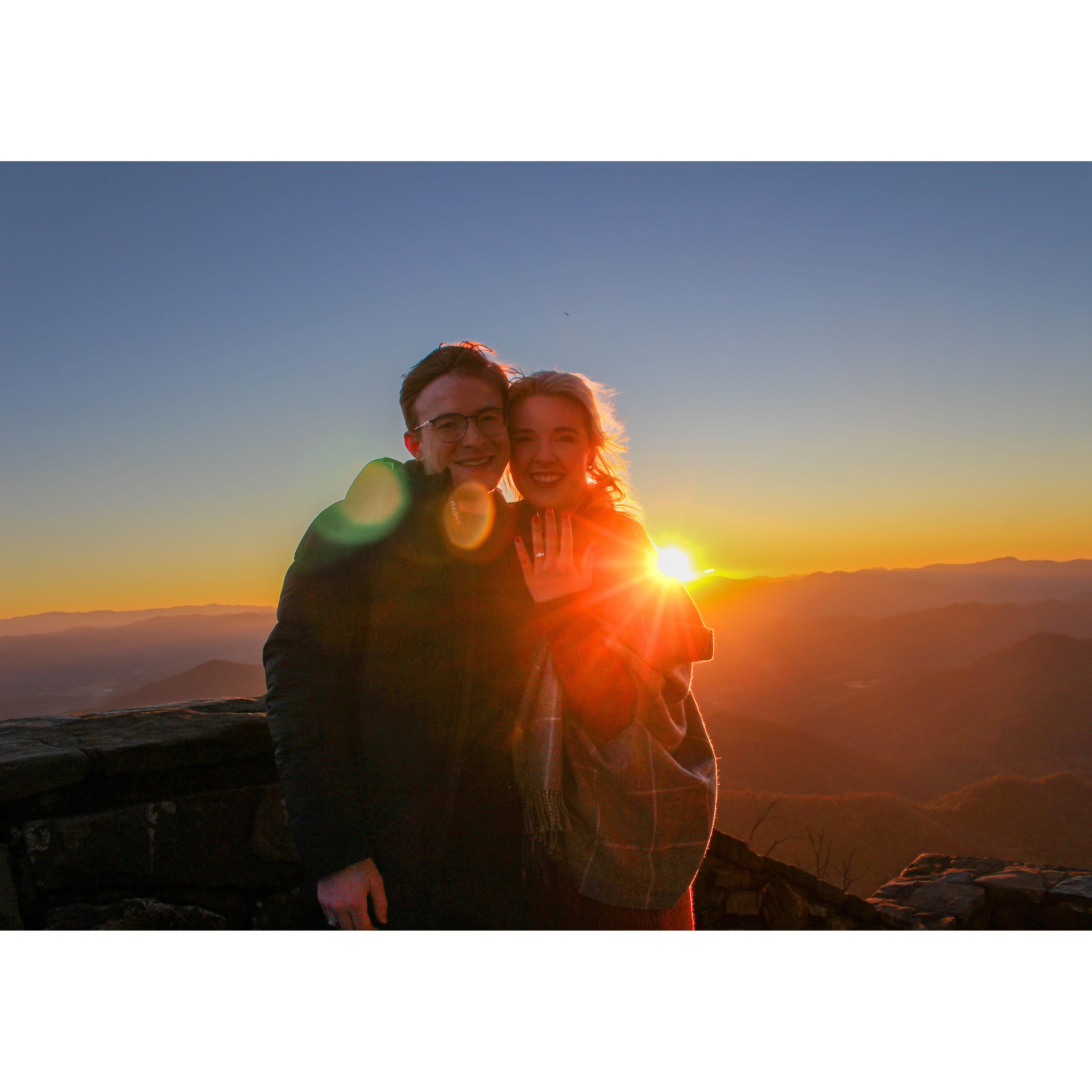 Geoffrey proposed to Abigail at sunrise on October 21, 2023. He took her to a lookout in Western NC, and they had the entire breathtaking view to themselves.