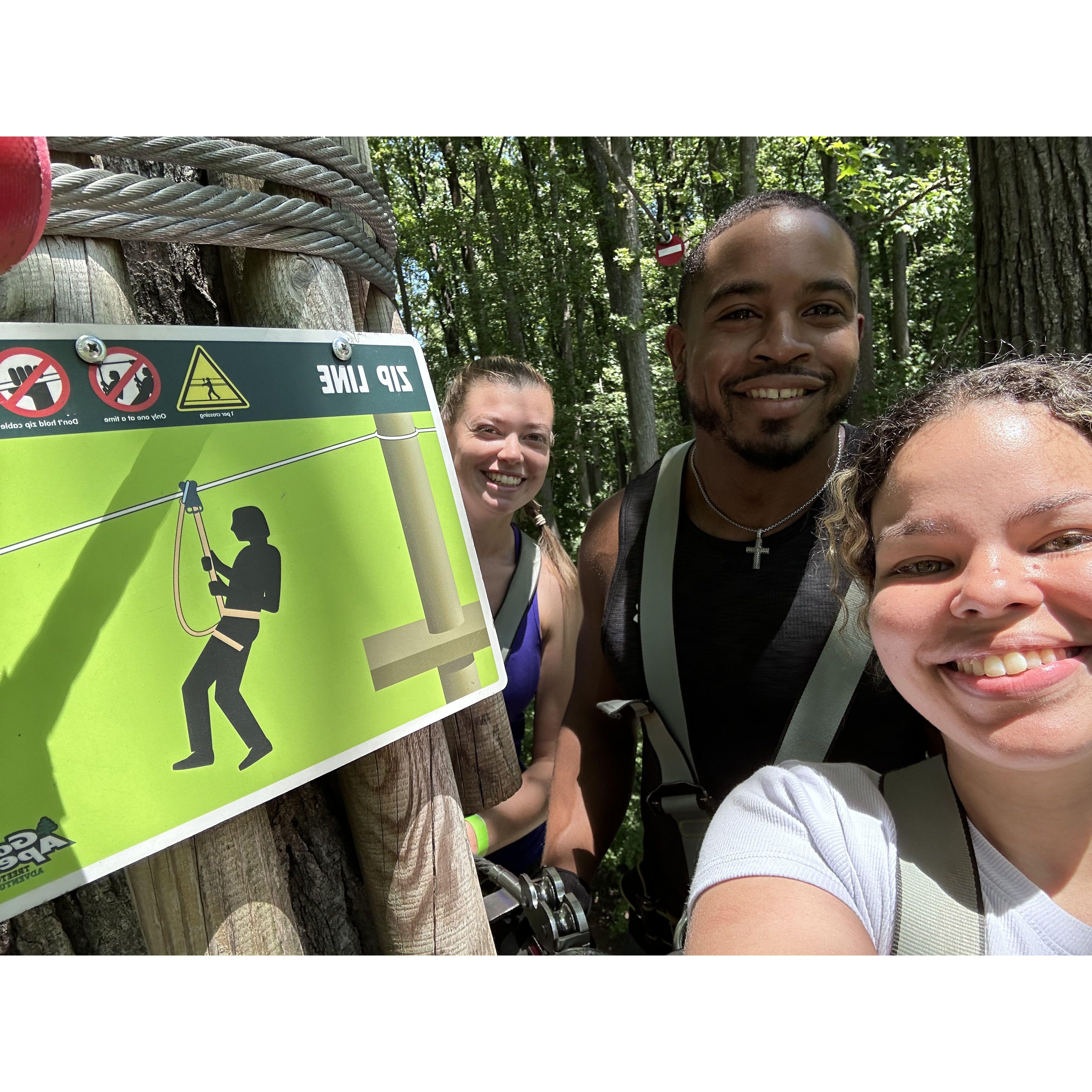 High in the trees! We went zip-lining with all our friends and were scared but had so much fun.