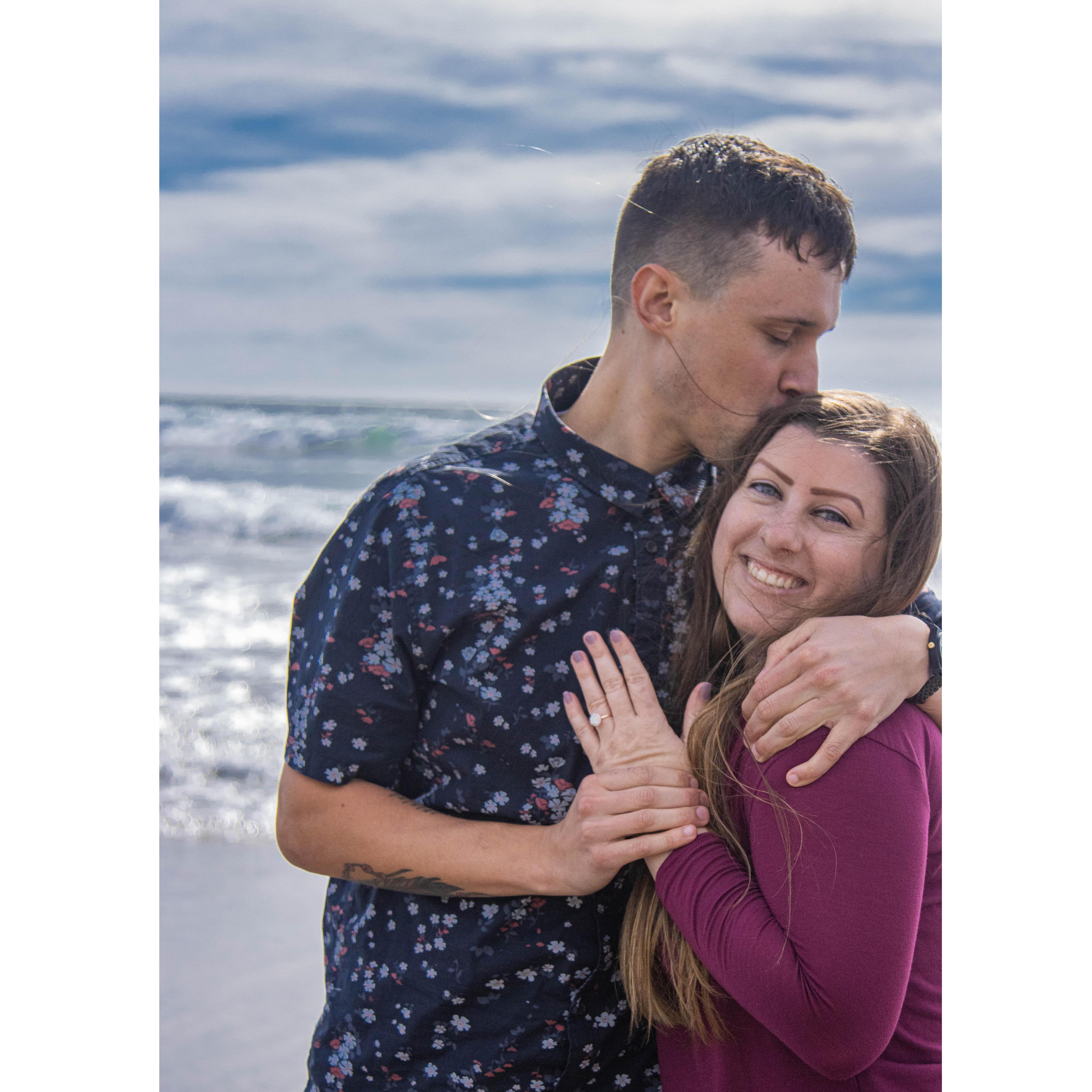 February 2021; another picture of the best day ever! He planned the most special proposal at Crystal Cove & had our closest friends and family waiting at the house to congratulate us!