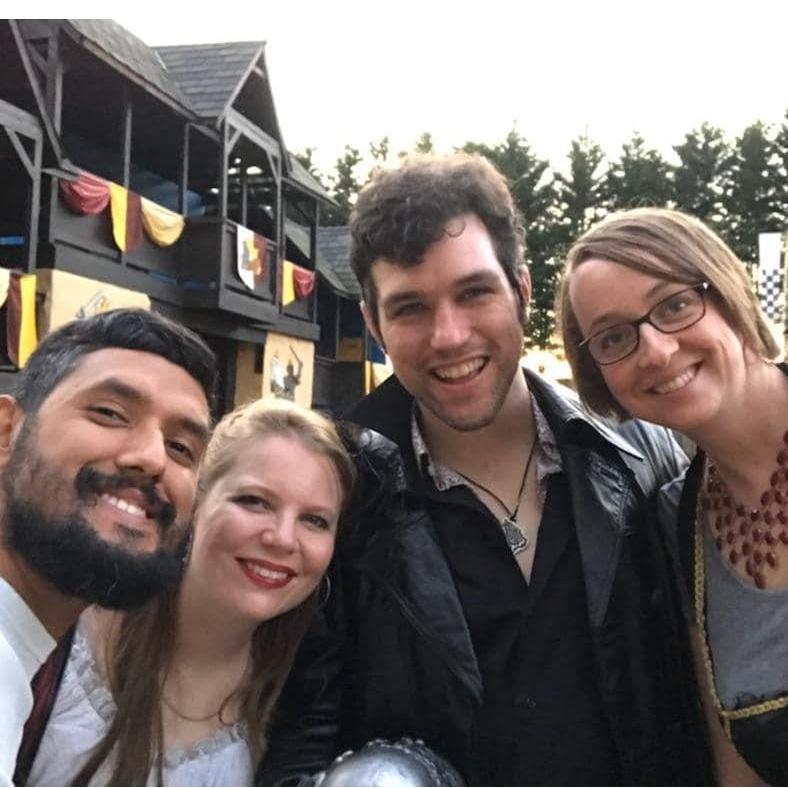 This is both of us at the Maryland Renaissance Festival with our two good friends, Carlos (one of the groomsmen) and Hillary, getting ready to see the jousting tournament!