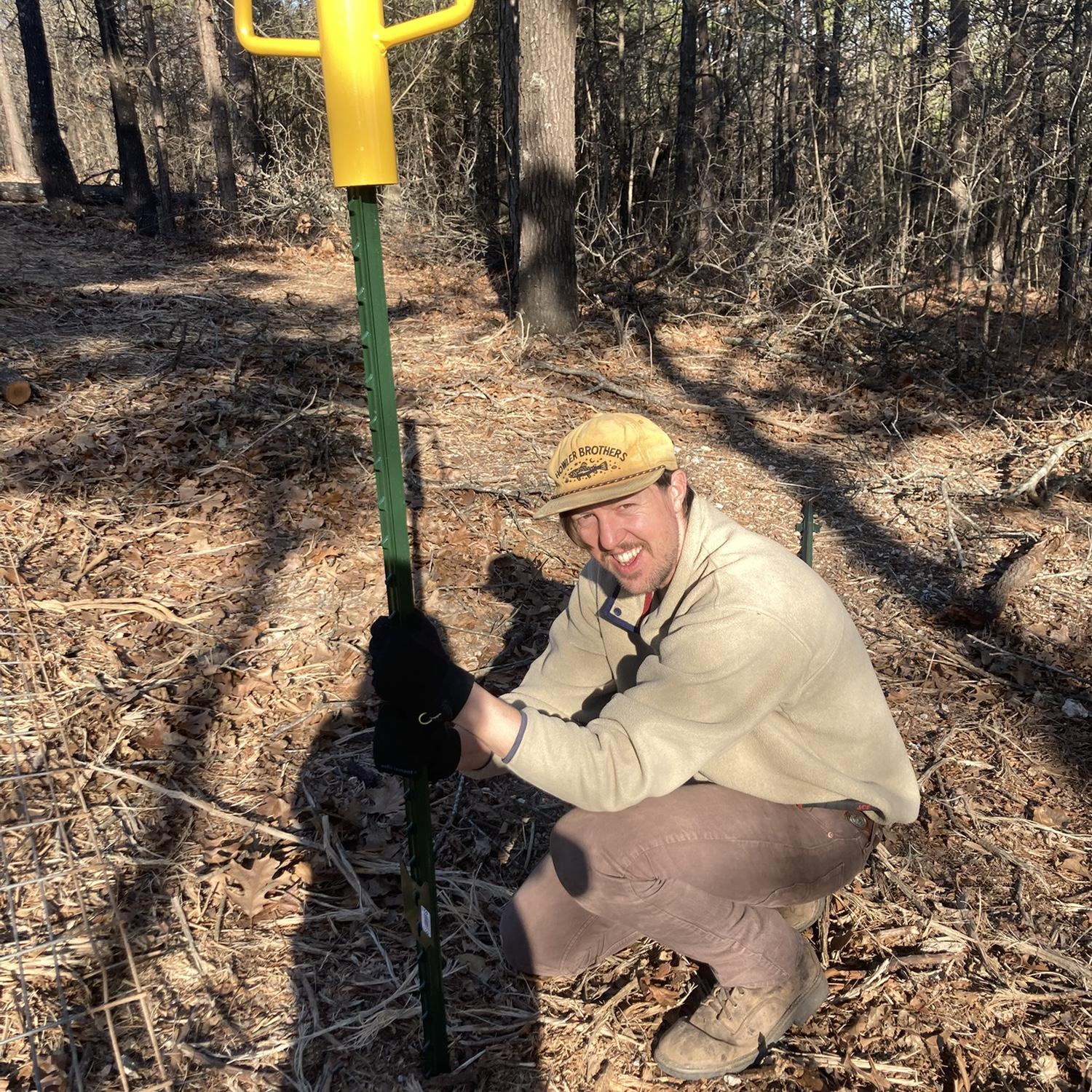 Pounding posts for our goat pen