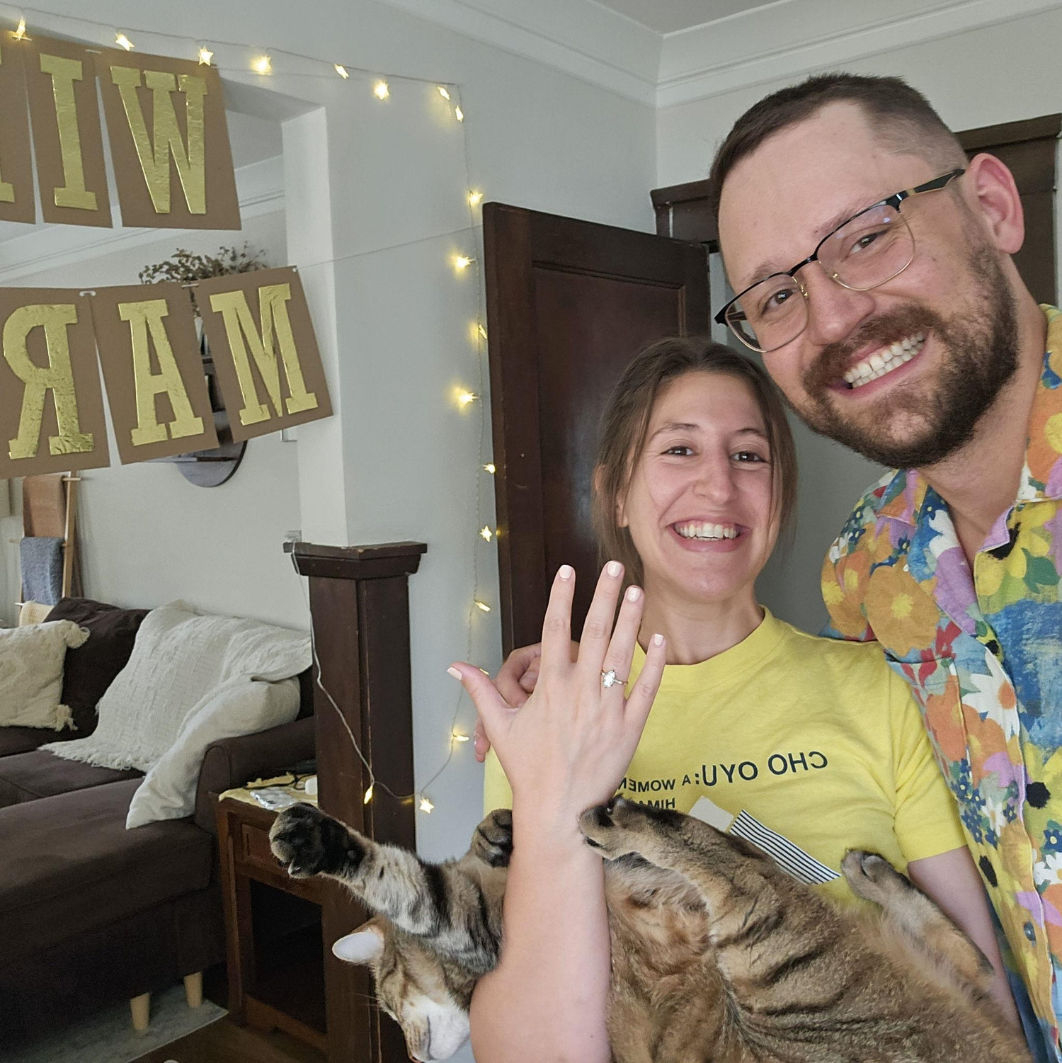 July 2025 | Katie returns home from a work trip and Michael proposes!