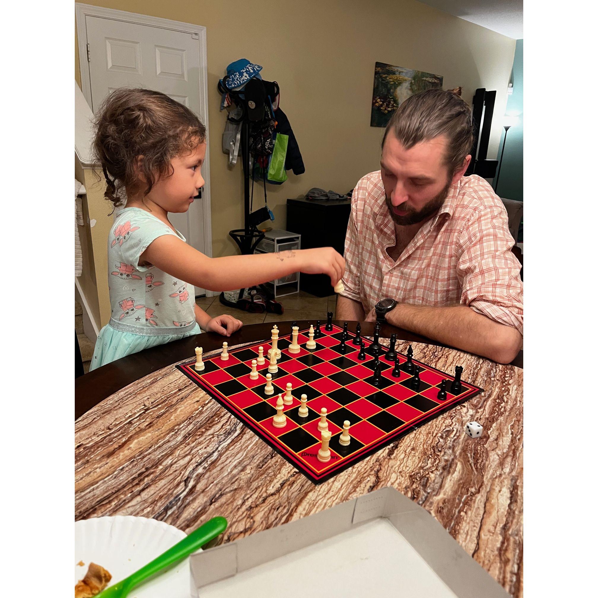 Anne teaching Justin Chess