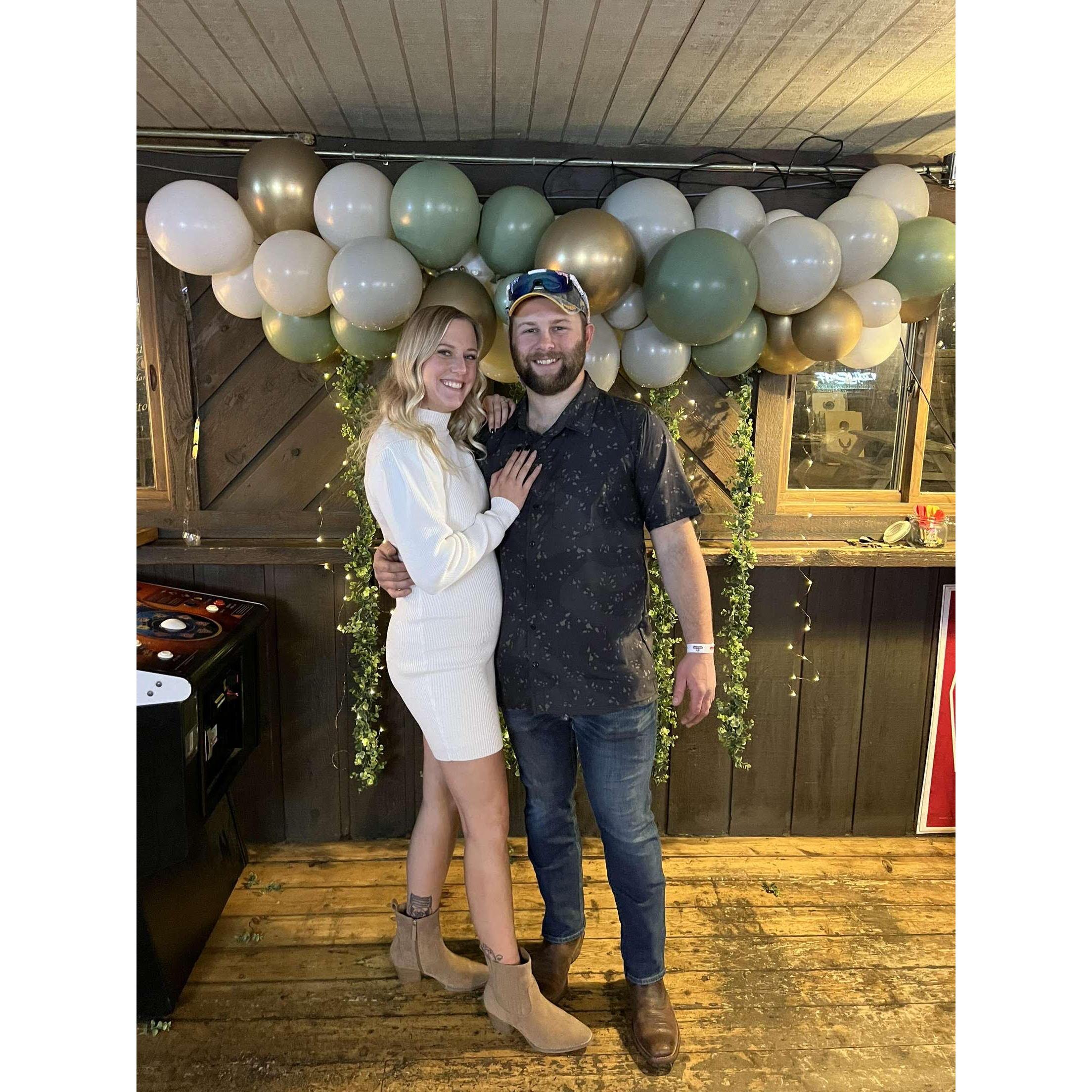 Us at our engagement party, before $200 worth of Malort was bought.