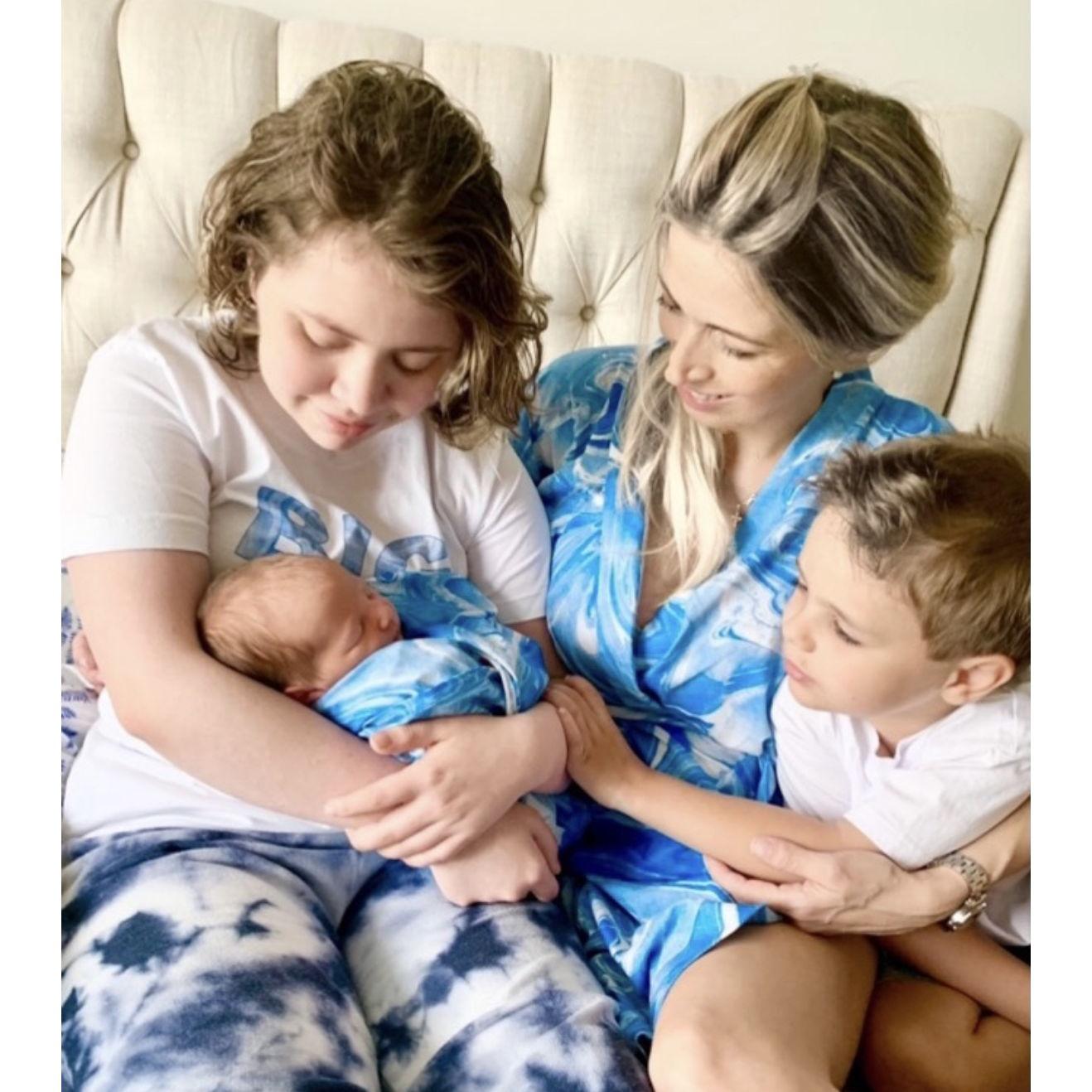 Bringing baby Michael home to his siblings