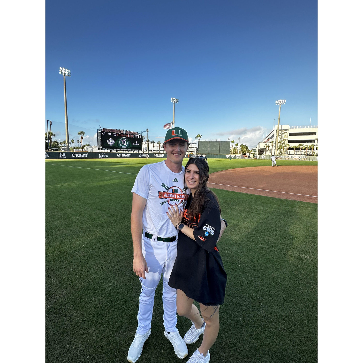 Sidney watching Cooper pitch at the Univeristy of Miami alumni baseball game