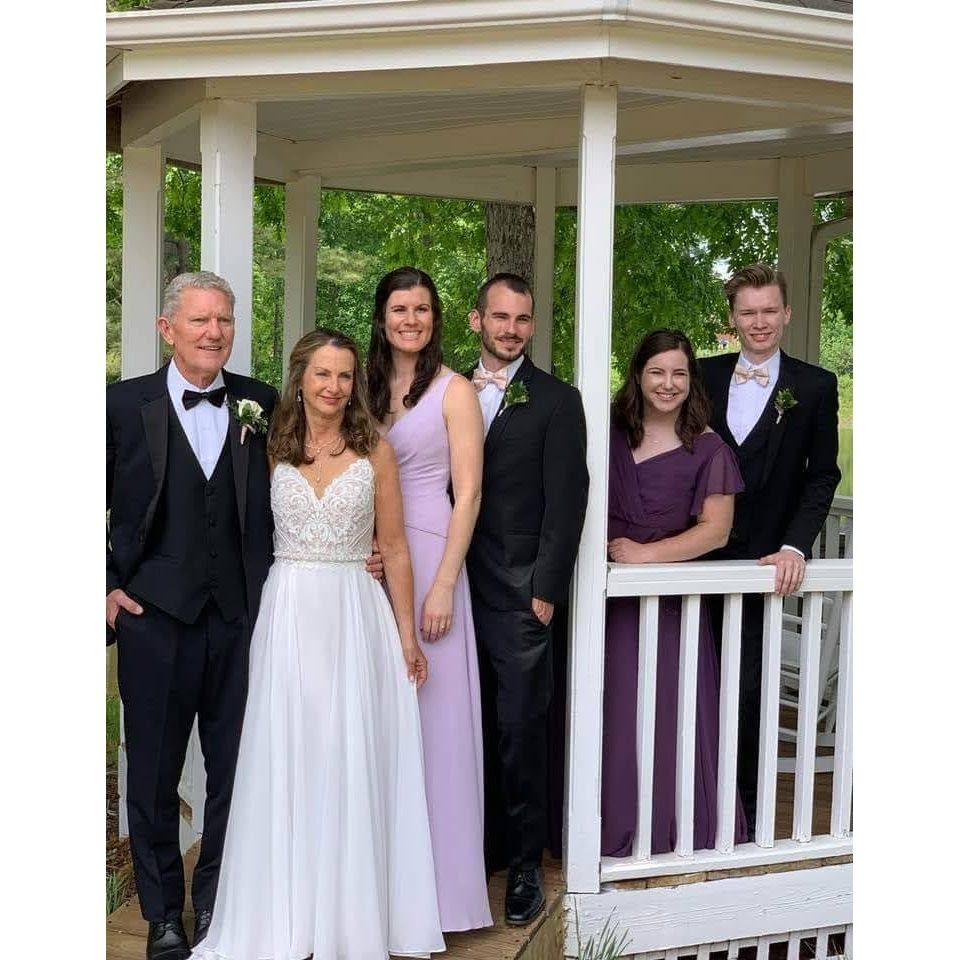 The future couple pictured with Adrien's mom, Patti, her husband Martin, Adrien's sister, Claire, and her boyfriend, Henry. Taken at Martin and Patti's wedding!