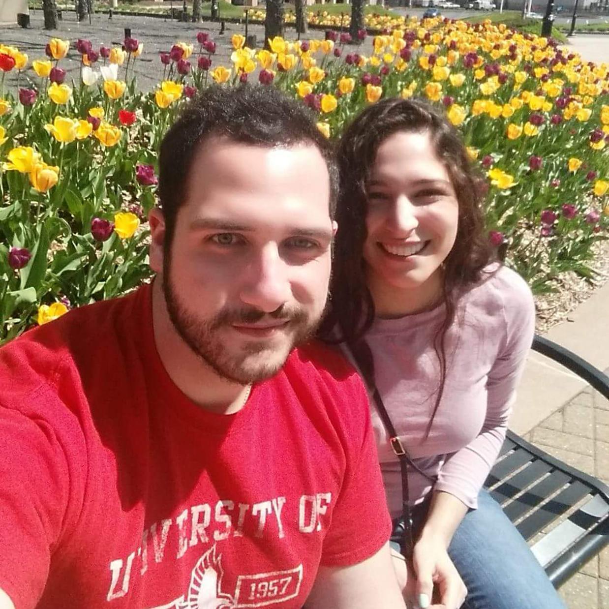 Pausing by a planting of tulips in the romantic Hartford, CT while on one of our first dates, 2014.