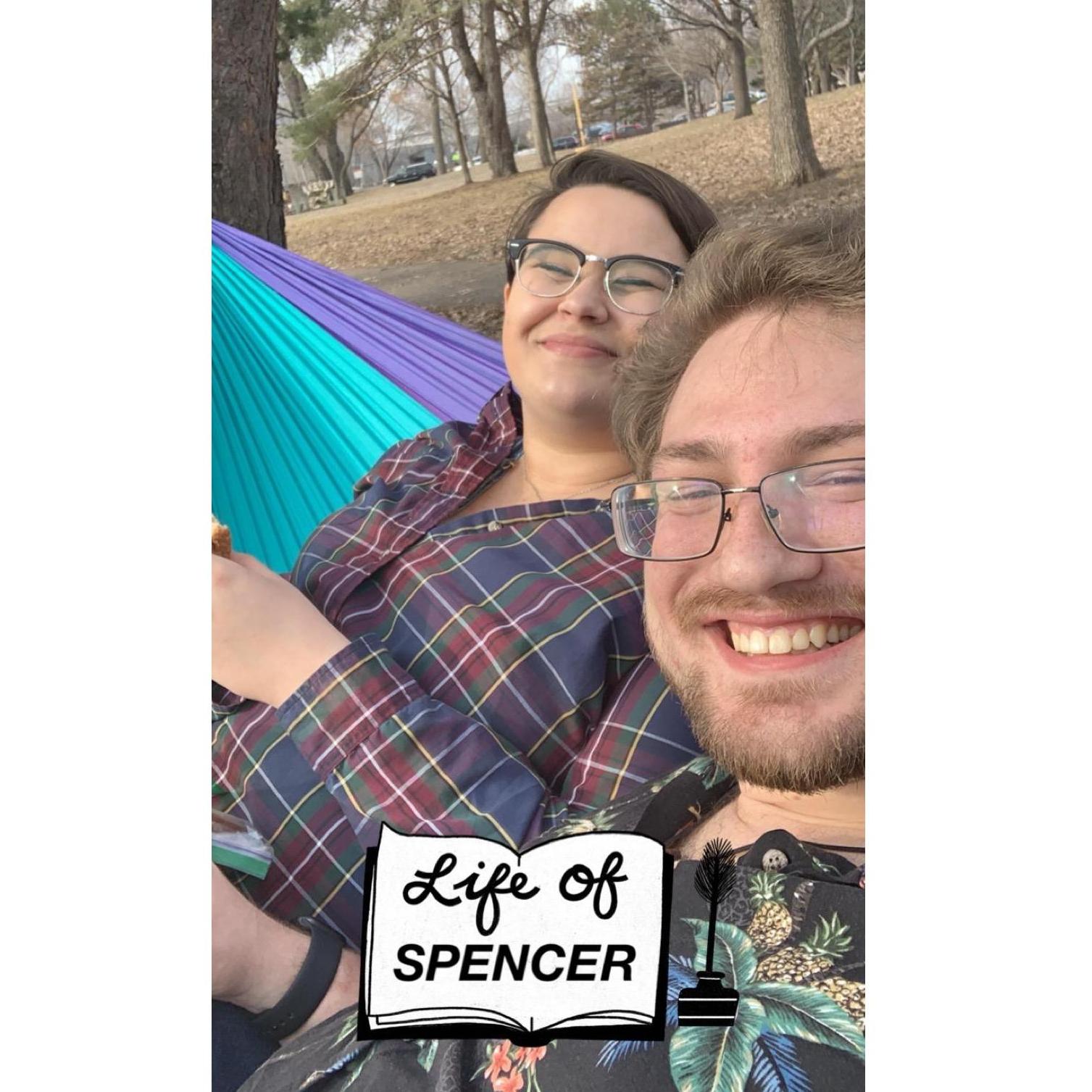 Hammocking together in a park nearby