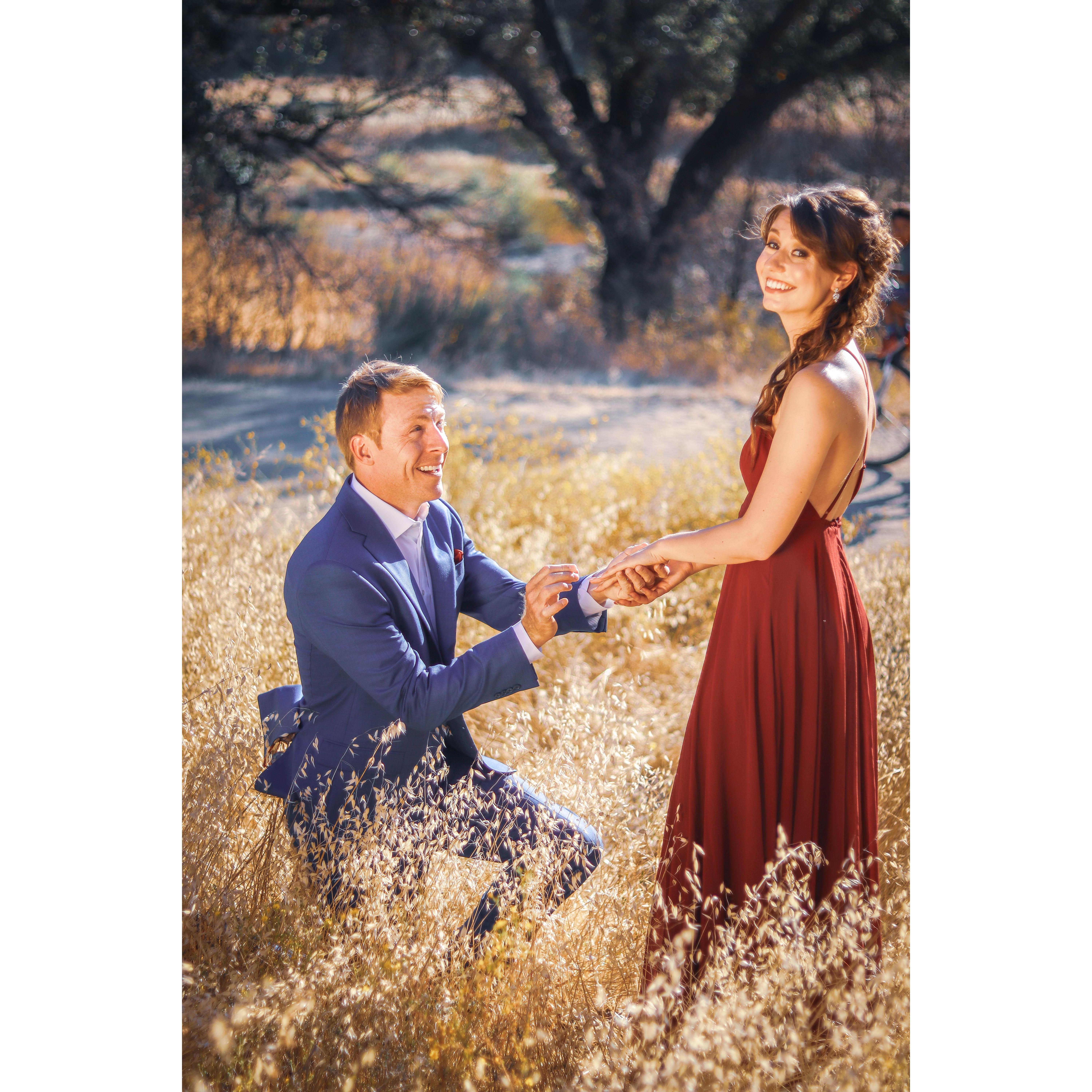 Reenactment Proposal in the hills of Malibu Creek State Park. You can see a cyclist in the background. We thought this was funny because of Nick's passion for his cycling hobby.