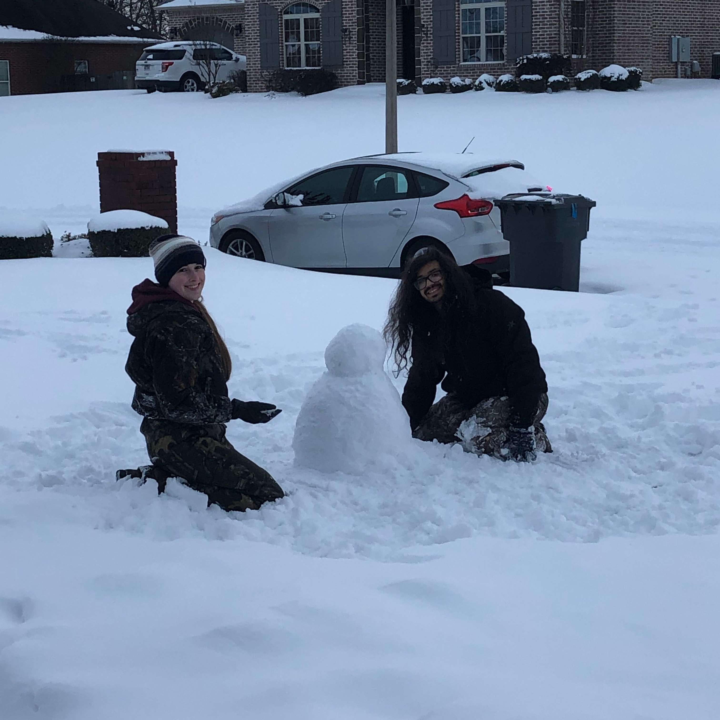 This photo was taken of us building a snowman during our first snow together. - February 18, 2021