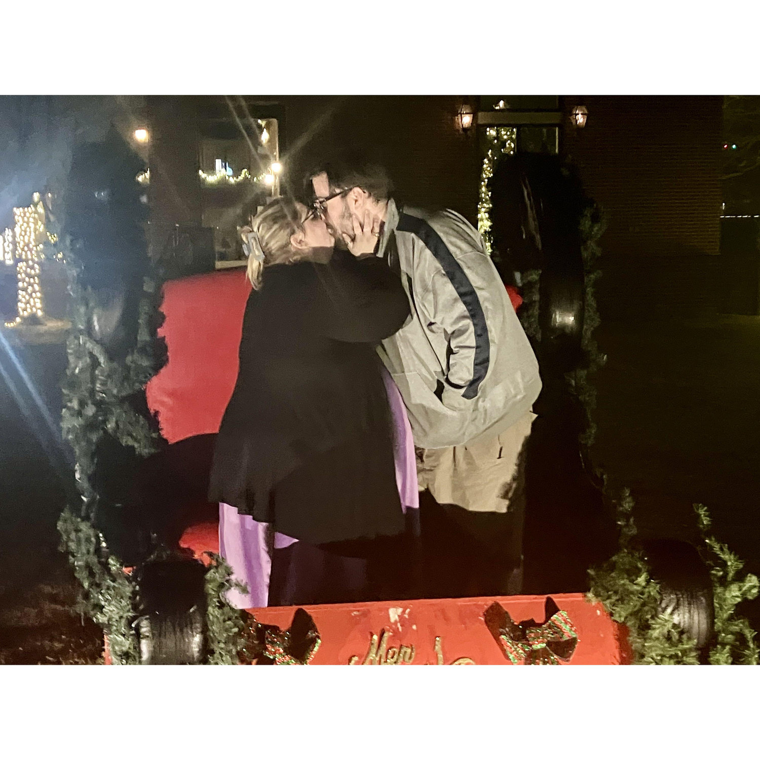 Christmas starts early these days, so the couple took a few pictures in this Christmas sleigh to commemorate the start of their first Christmas season while dating.