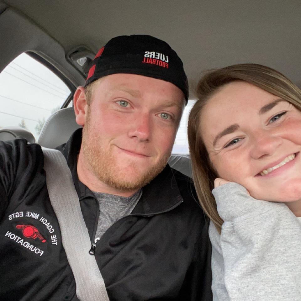 Our first Luers football season as a couple. Kennedy will take books to games when watching Matt coach.