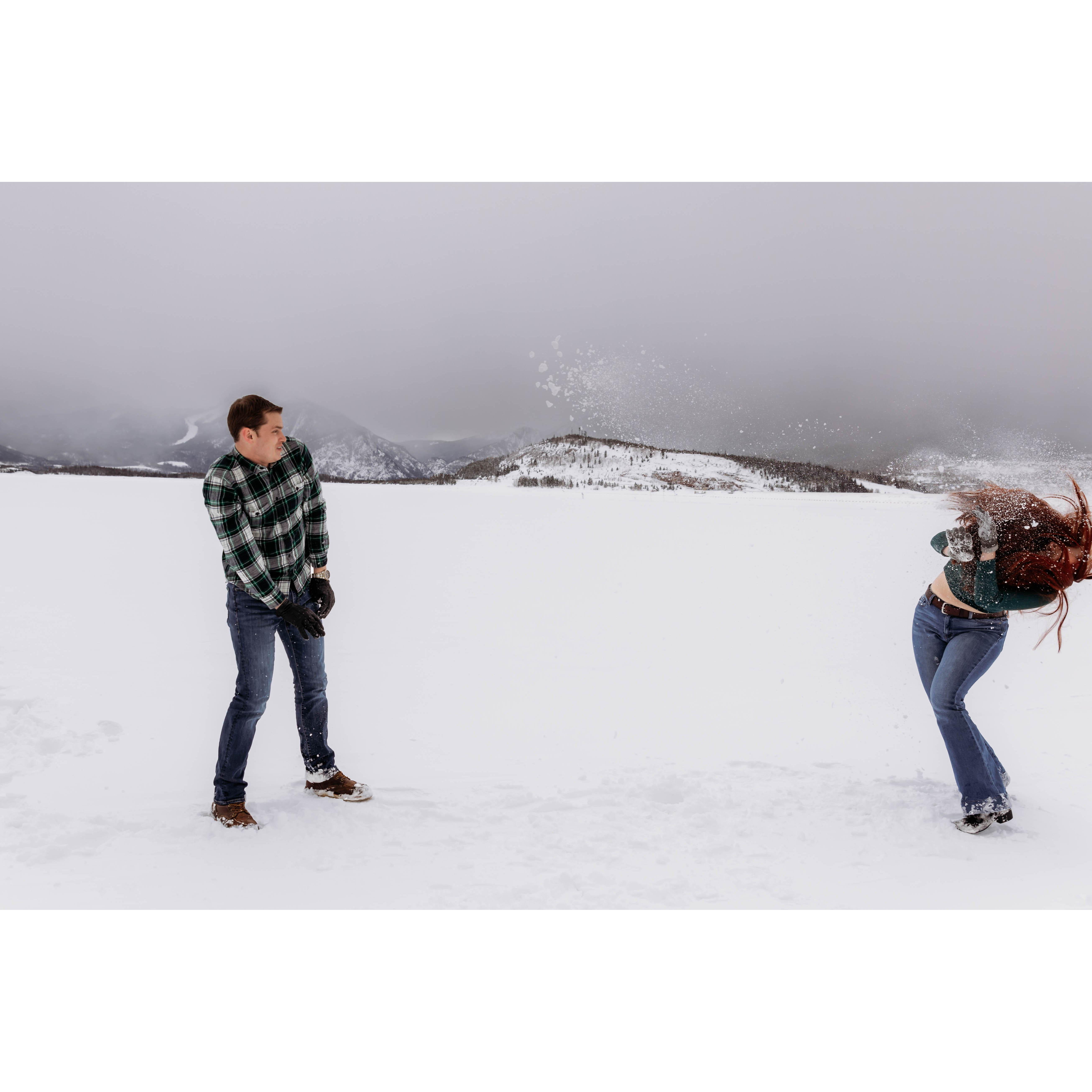 The photographer said "playfully throw a snowball"...