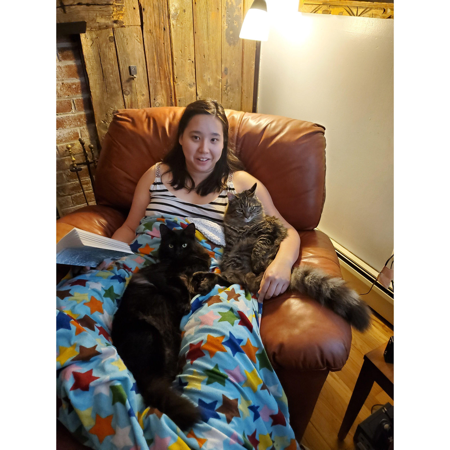 Dani reads a bedtime story to the kitties
