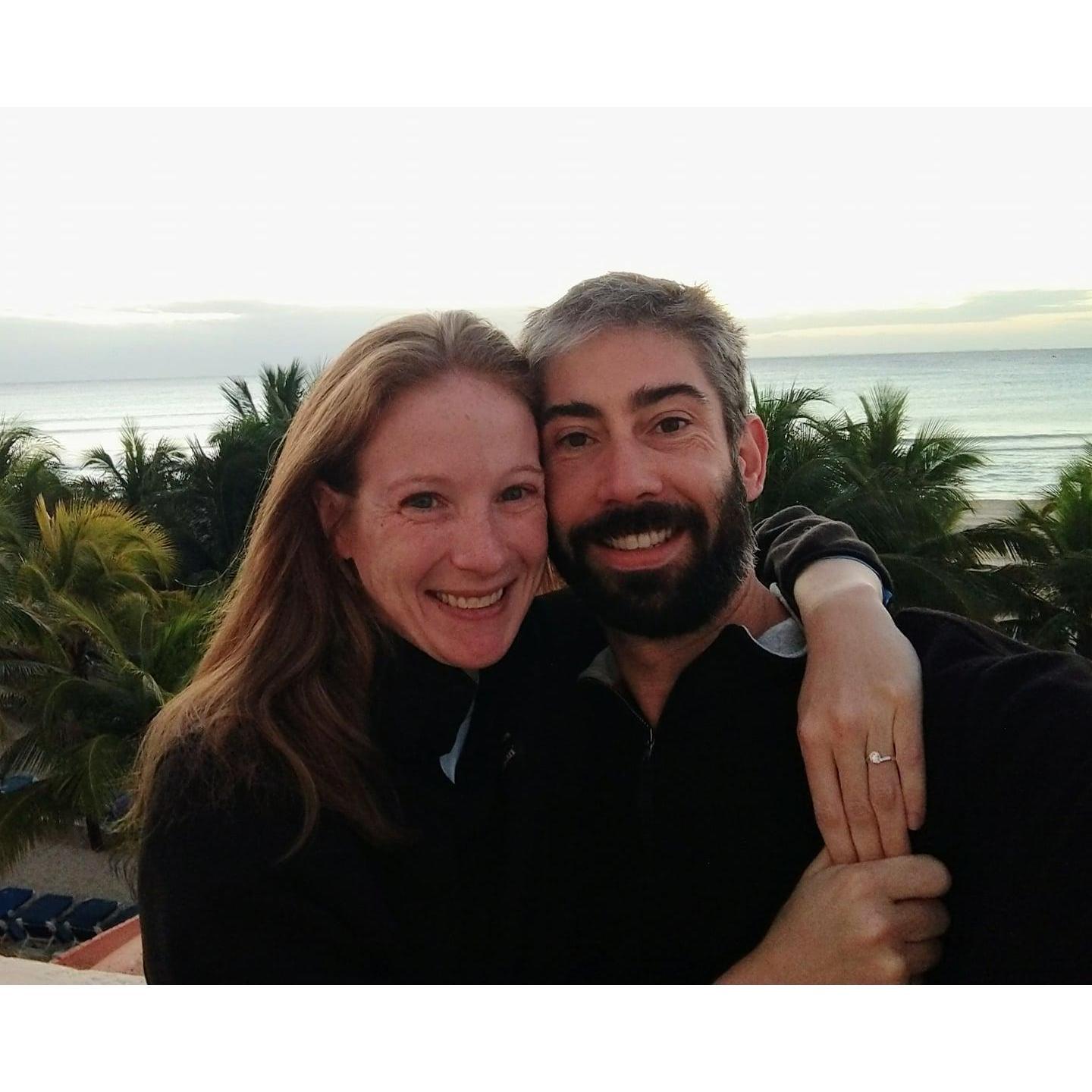 Two days after getting engaged in Mexico, we rolled out of bed and took a picture right after sunrise.  If we'd known it was going to become our engagement pic we would have brushed our hair!
