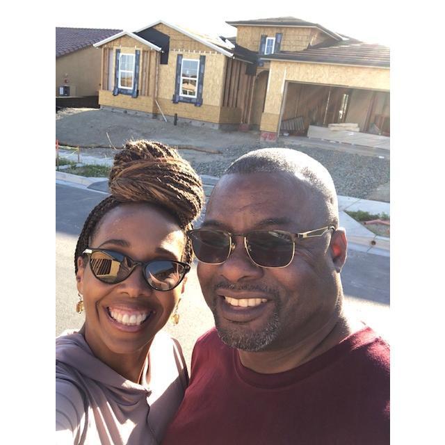In front of our new home while under construction.