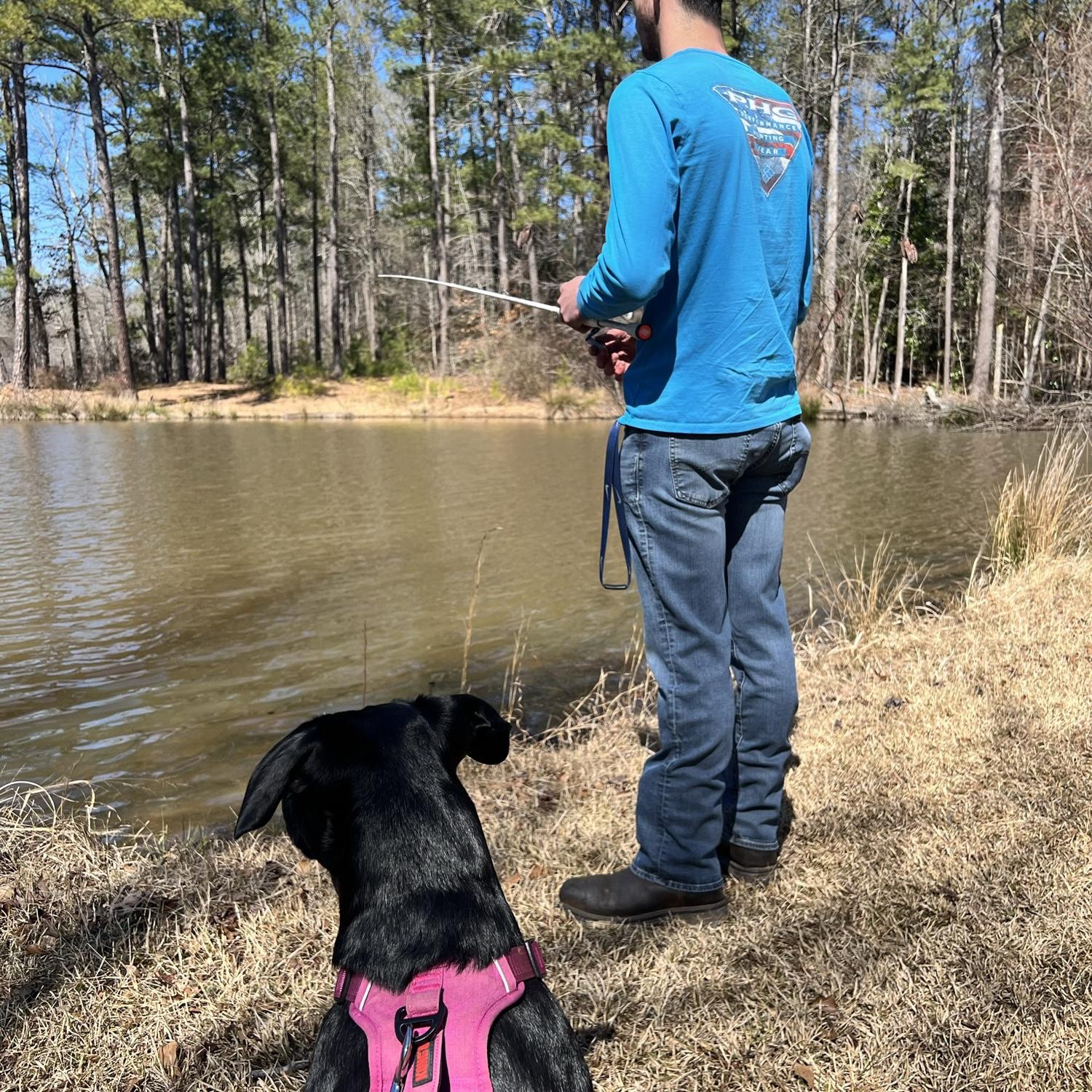 Eric and his fishing buddy Kleo hard at work! Im suprised we kept her out of the water!