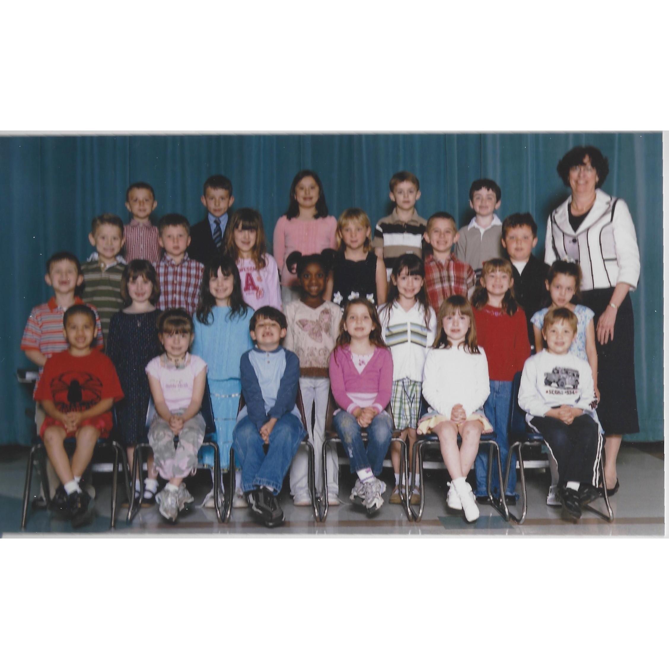 First grade class photo: Cassidy in the middle on the top row and Aidan in the top row all the way to the right