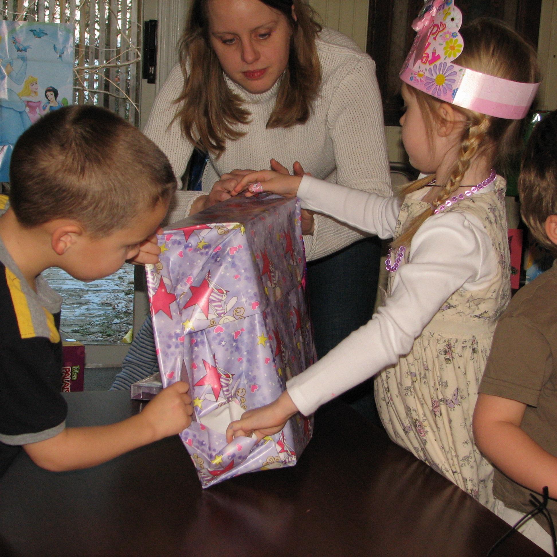 Brandon at Sadie's 5th birthday party helping open the gifts