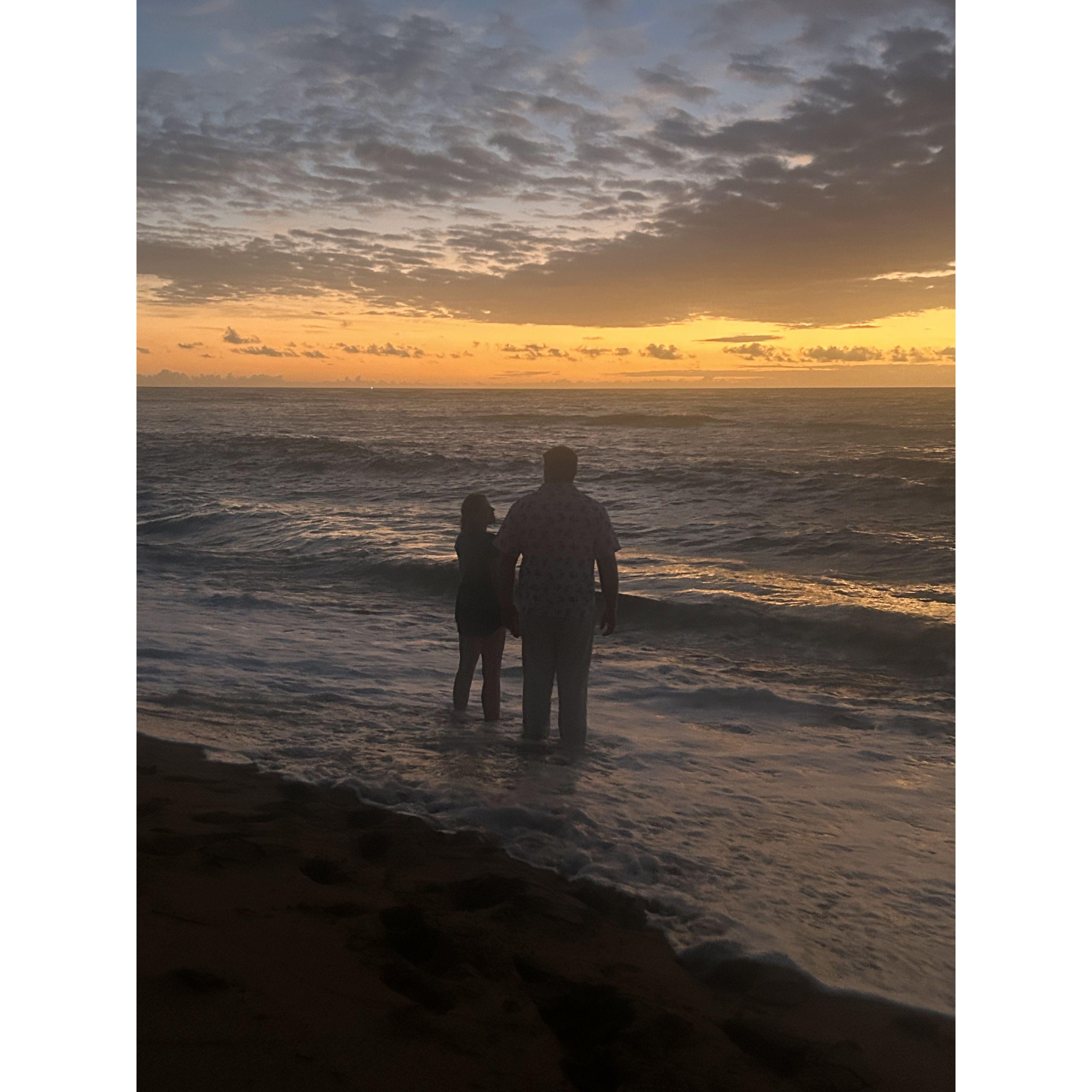Sunset on the beach during their Hawaii trip 2024.