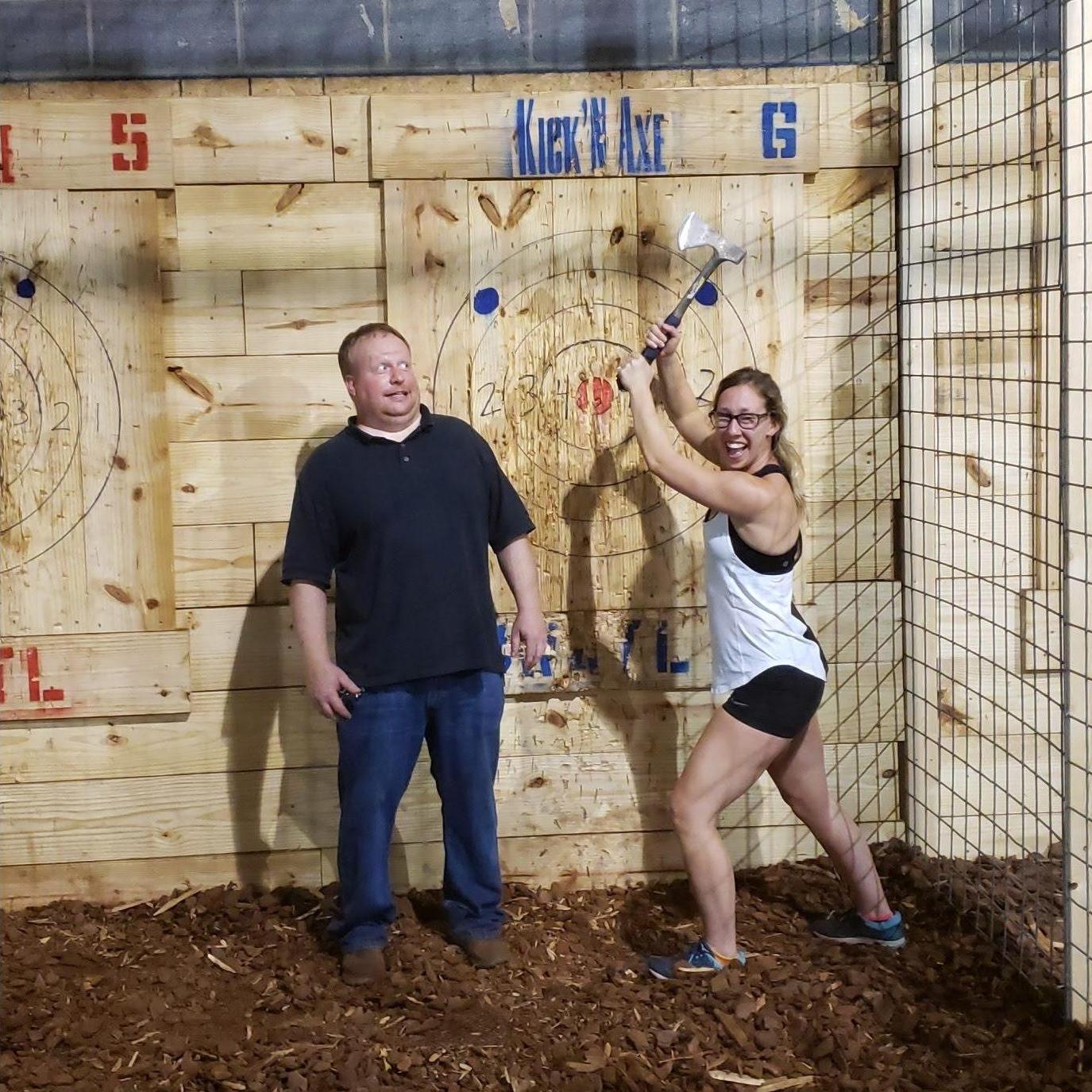 Axe throwing in Fredericksburg, VA.  Disclaimer: No llamas were injured during the filming of this photo.