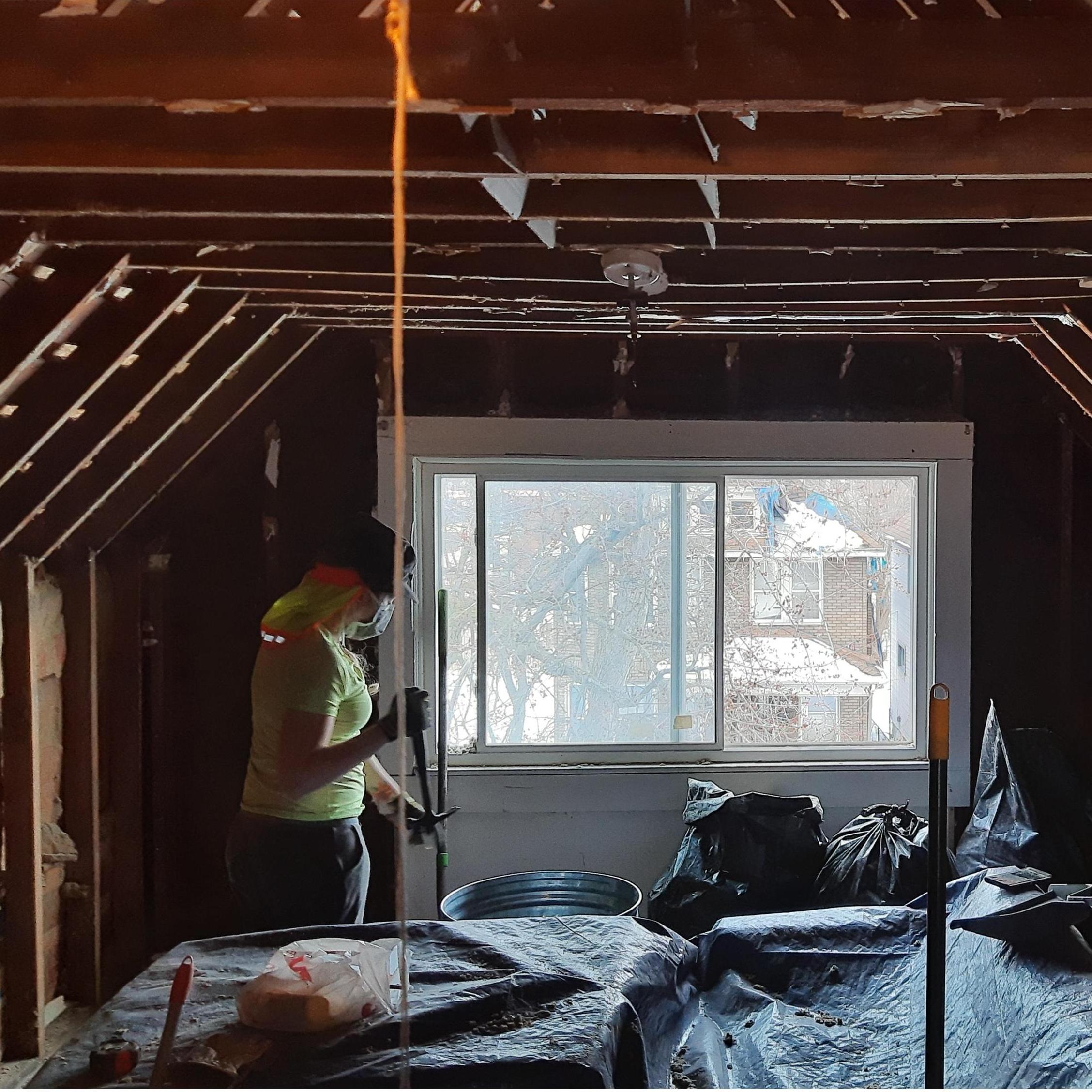 Micah and I demolishing the attic! Still in the middle of renovations. . .