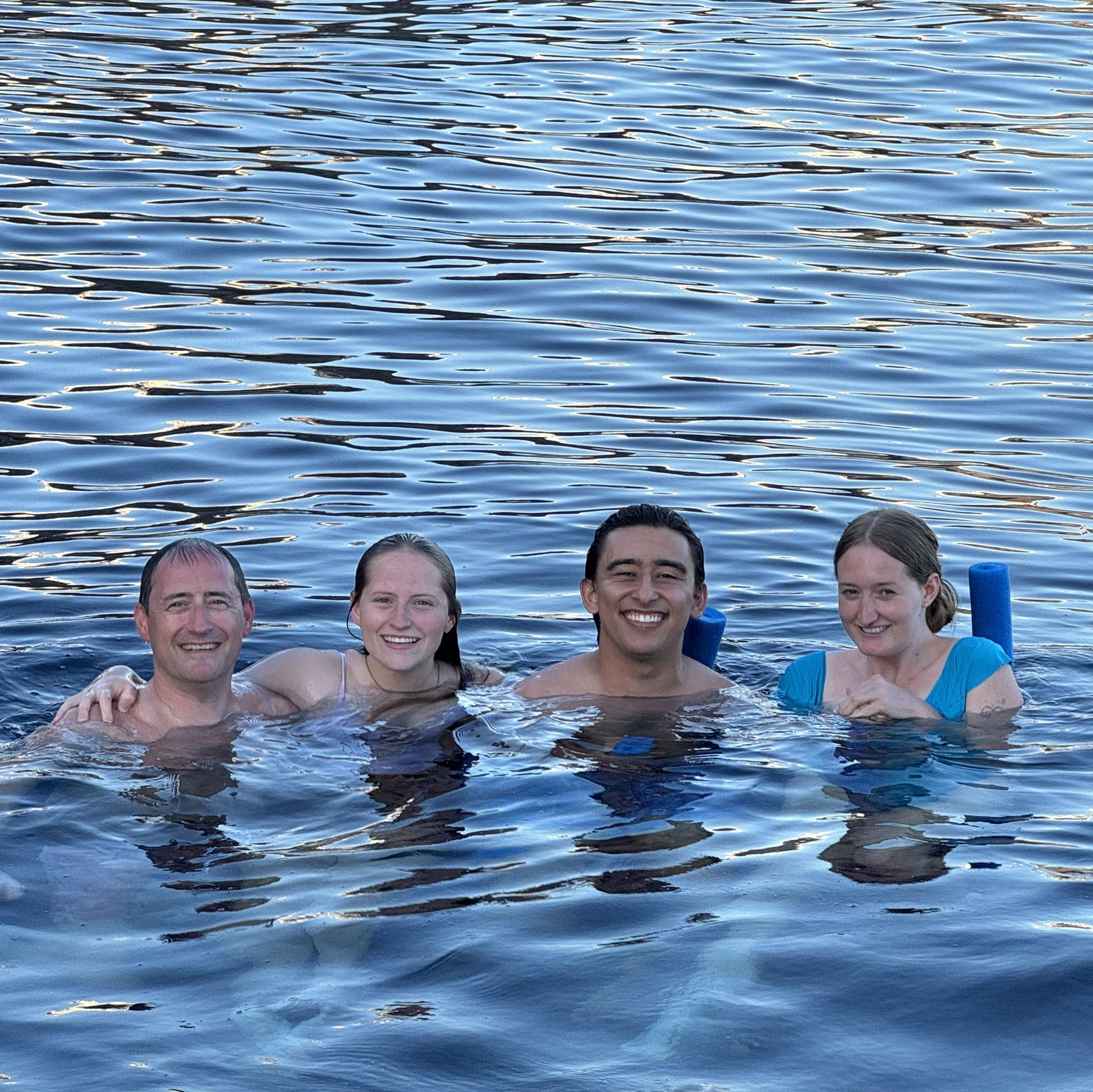 The bride & groom in Greece with the bride's dad & sister