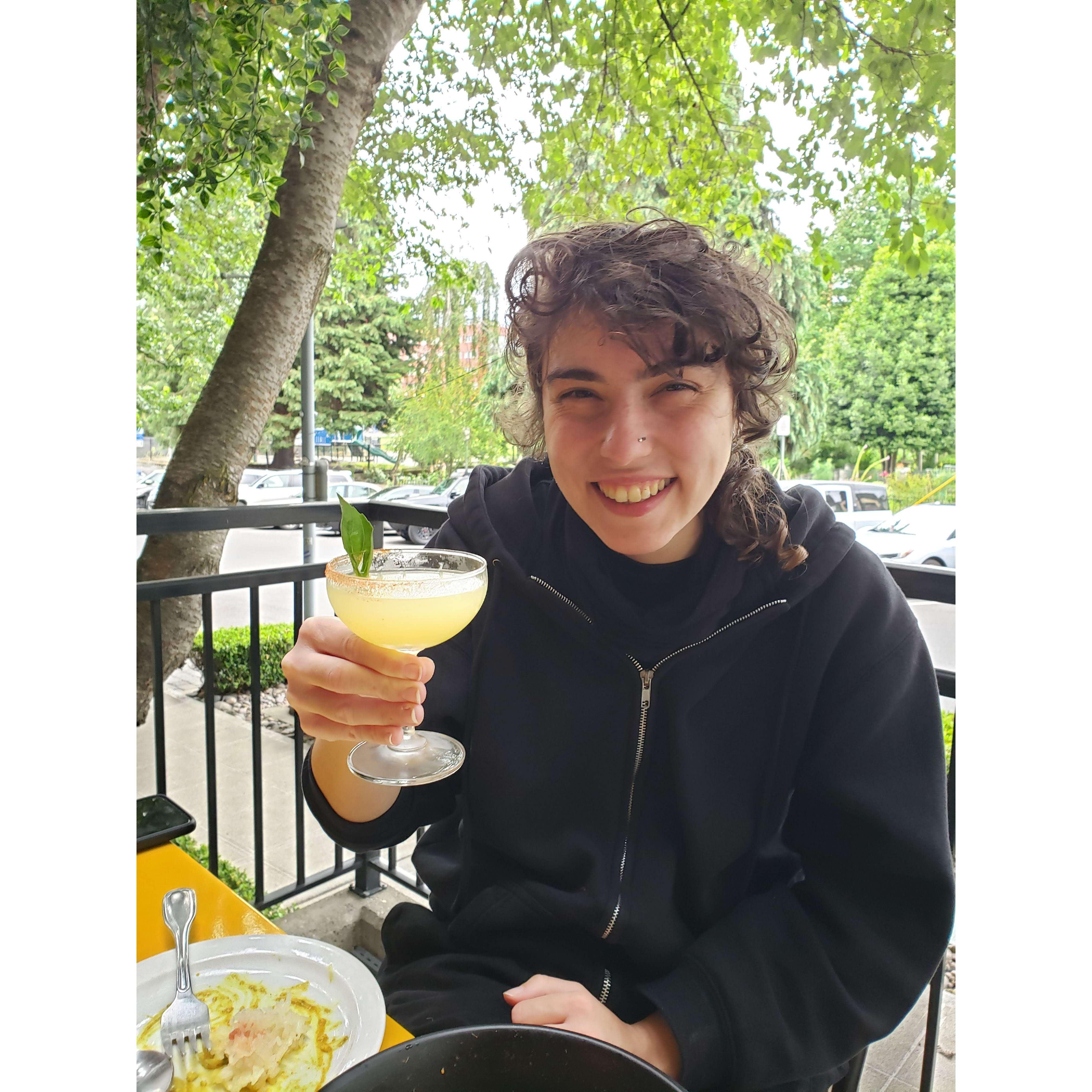 Rex enjoying a cocktail at Kati Vegan Thai in Seattle