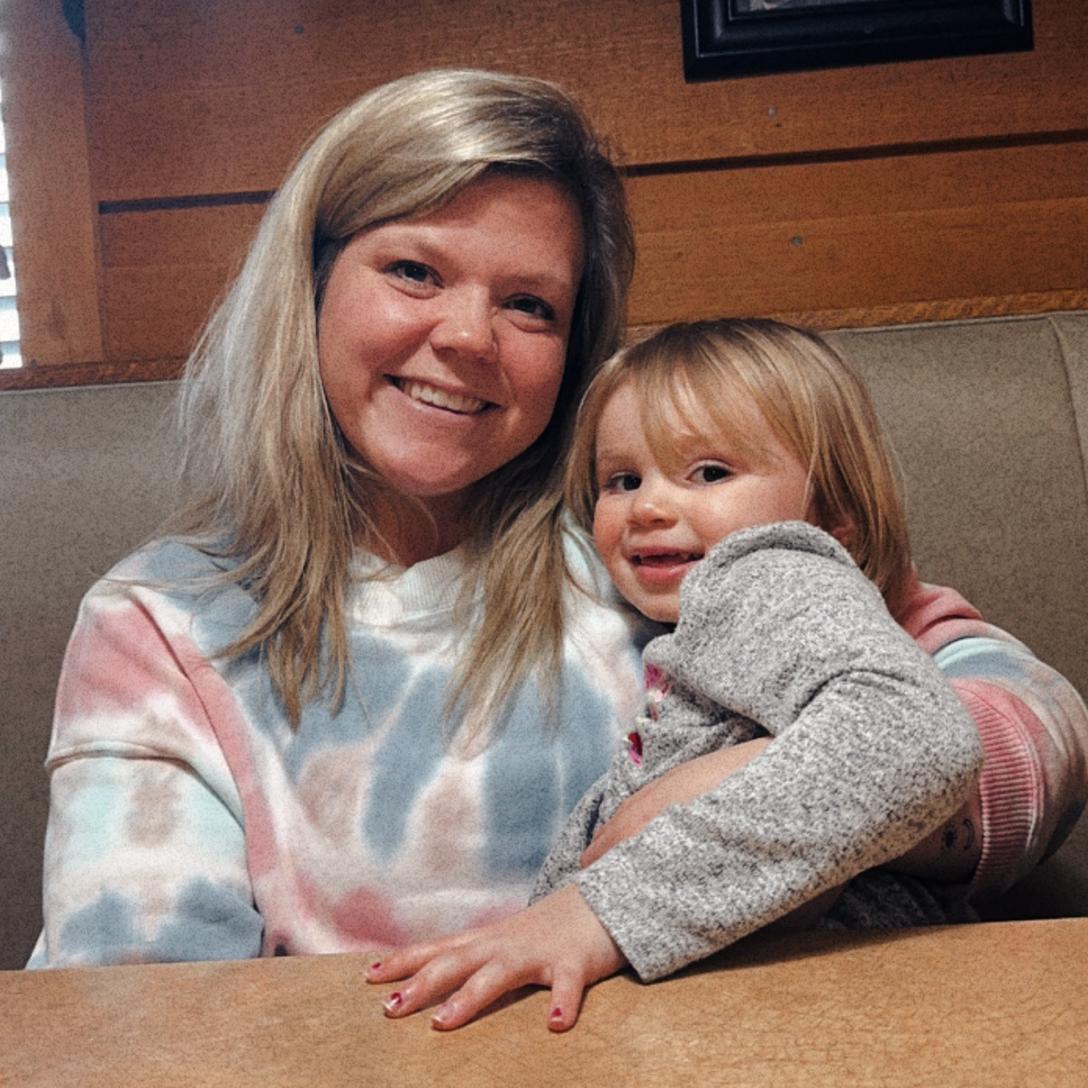 Kristi and Evie at a local bbq place in town.  The day y’all leave Kristi slips in the bathroom, get injured, rips a tendon, and still sits in the car for 5 hours on the way home. No wet floor sign